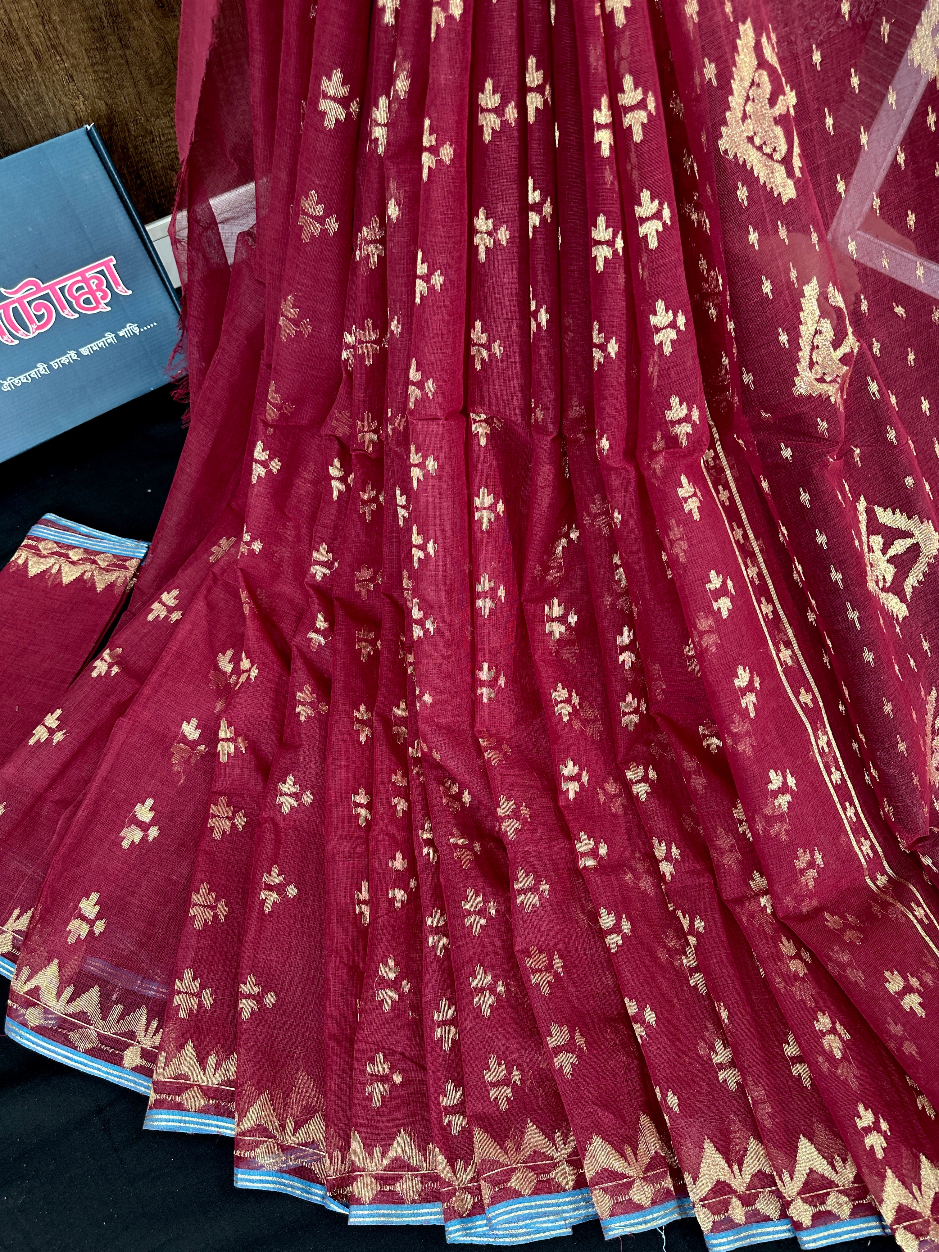 Maroon cotton jamdani saree with golden jori work and blouse piece.