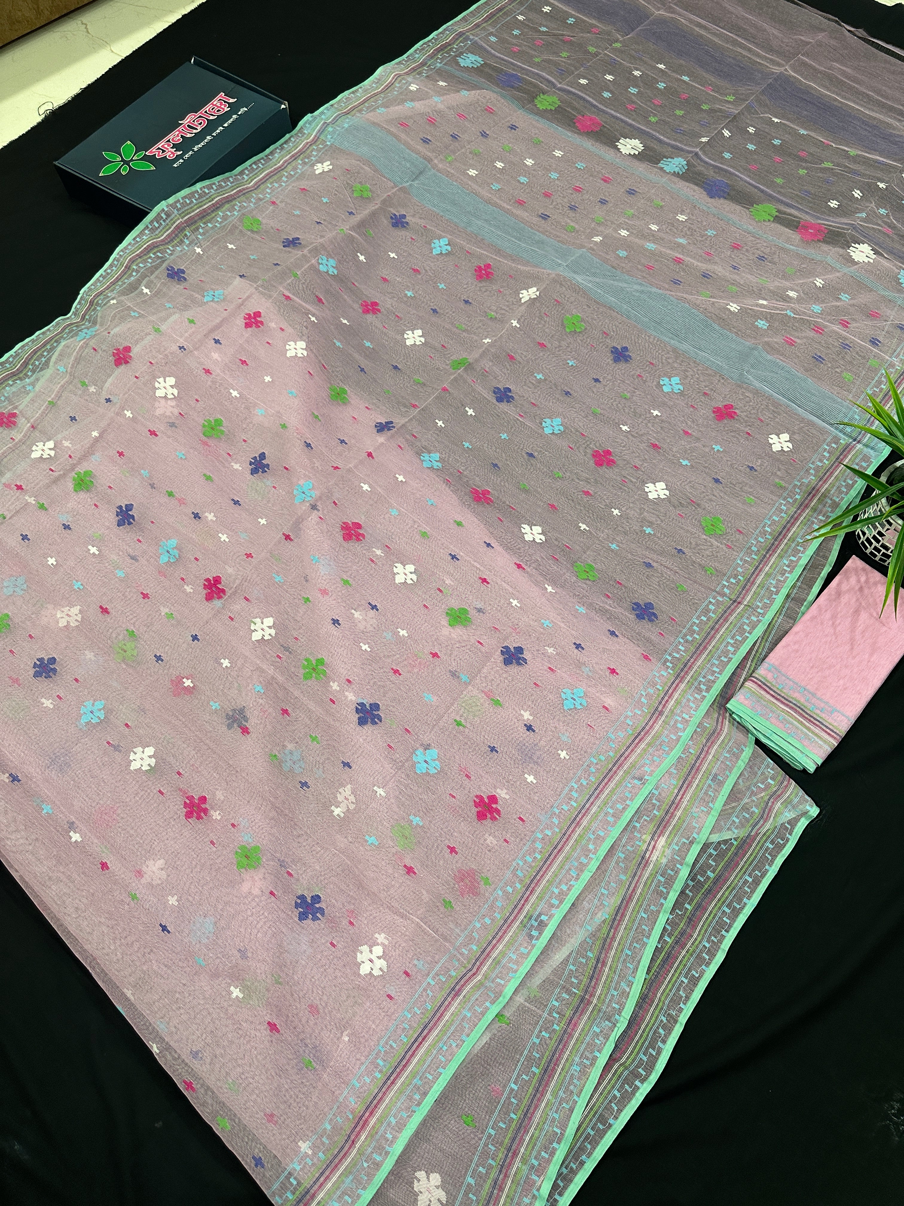 Baby pink jamdani saree with blue pink green threats work and blouse piece.