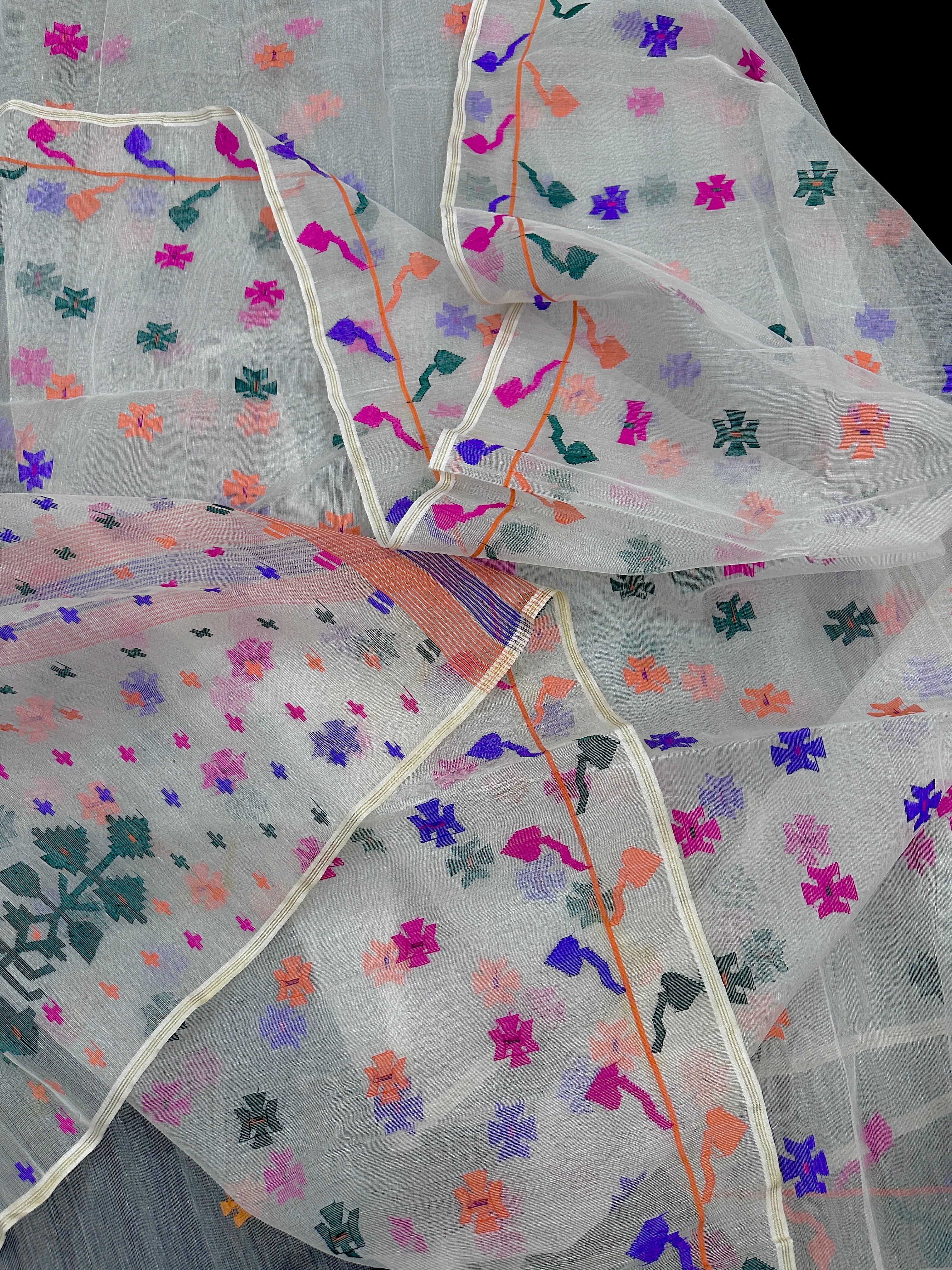 White jamdani saree with purple pink green orange threads work.