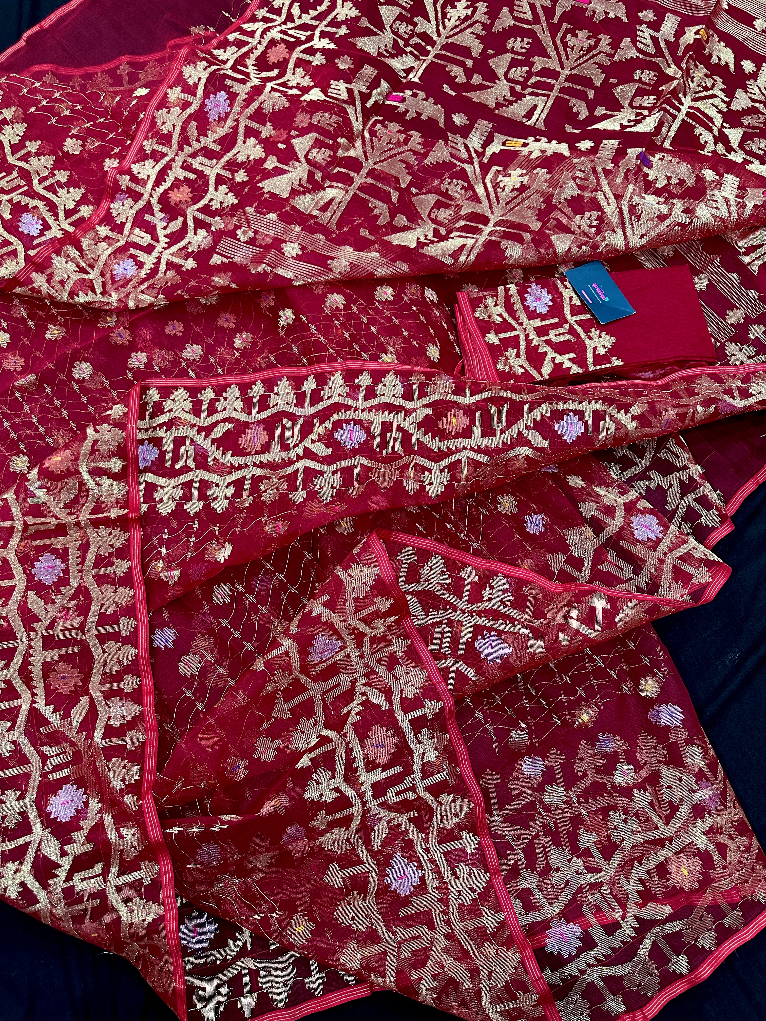 Reddish Maroon Bridal Exclusive dhakai jamdani saree with all over golden jori work soft count.