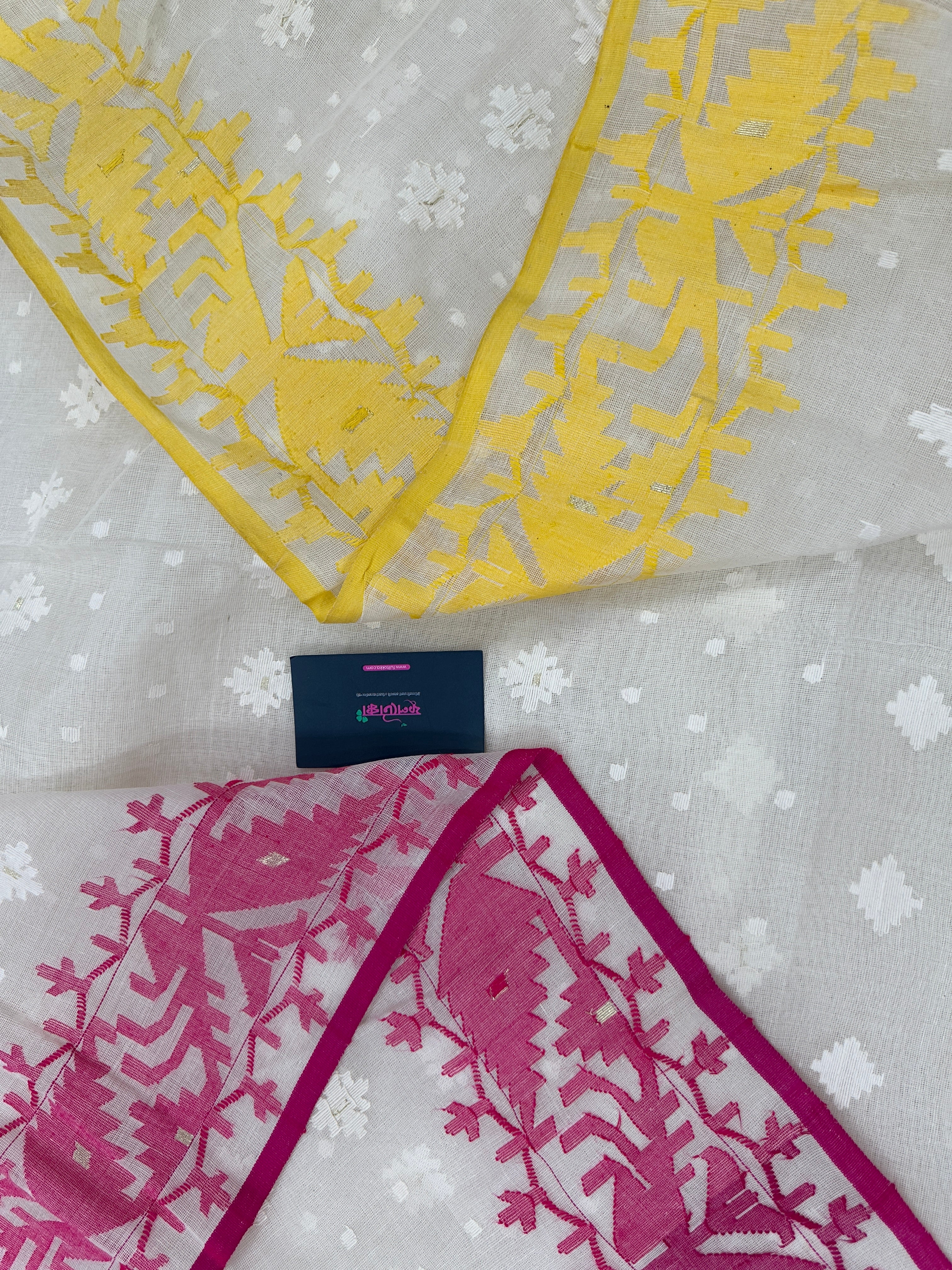 White cotton gonga jamuna design jamdani saree with pink & yellow threads work.