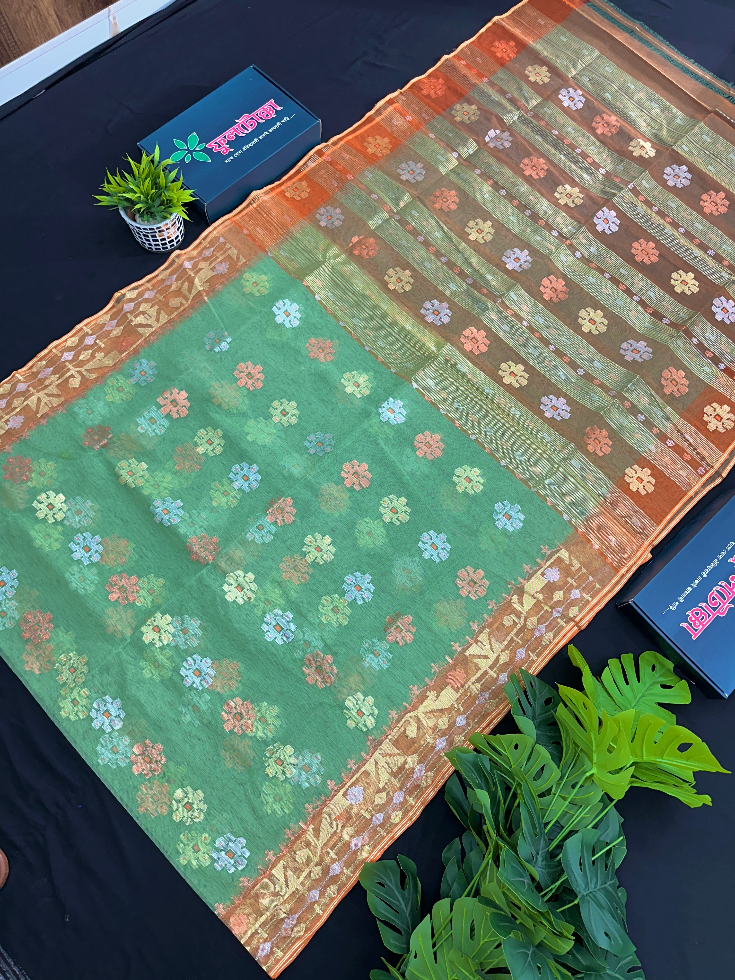 Pastel green halfsilk jamdani saree with golden brown contrast and golden silver copper jori work