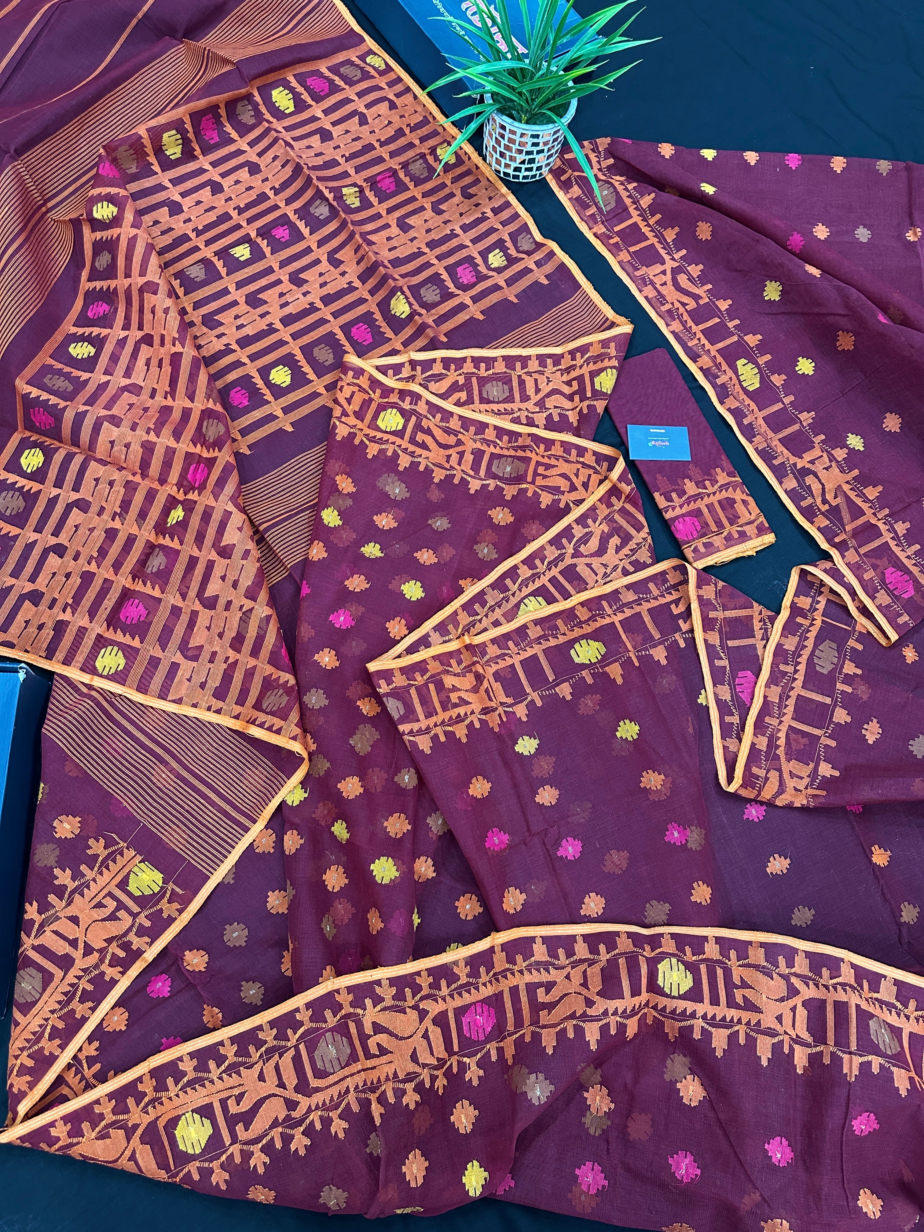 Bitrut colour cotton jamdani saree with yellow orange and pink threads work & blouse piece.