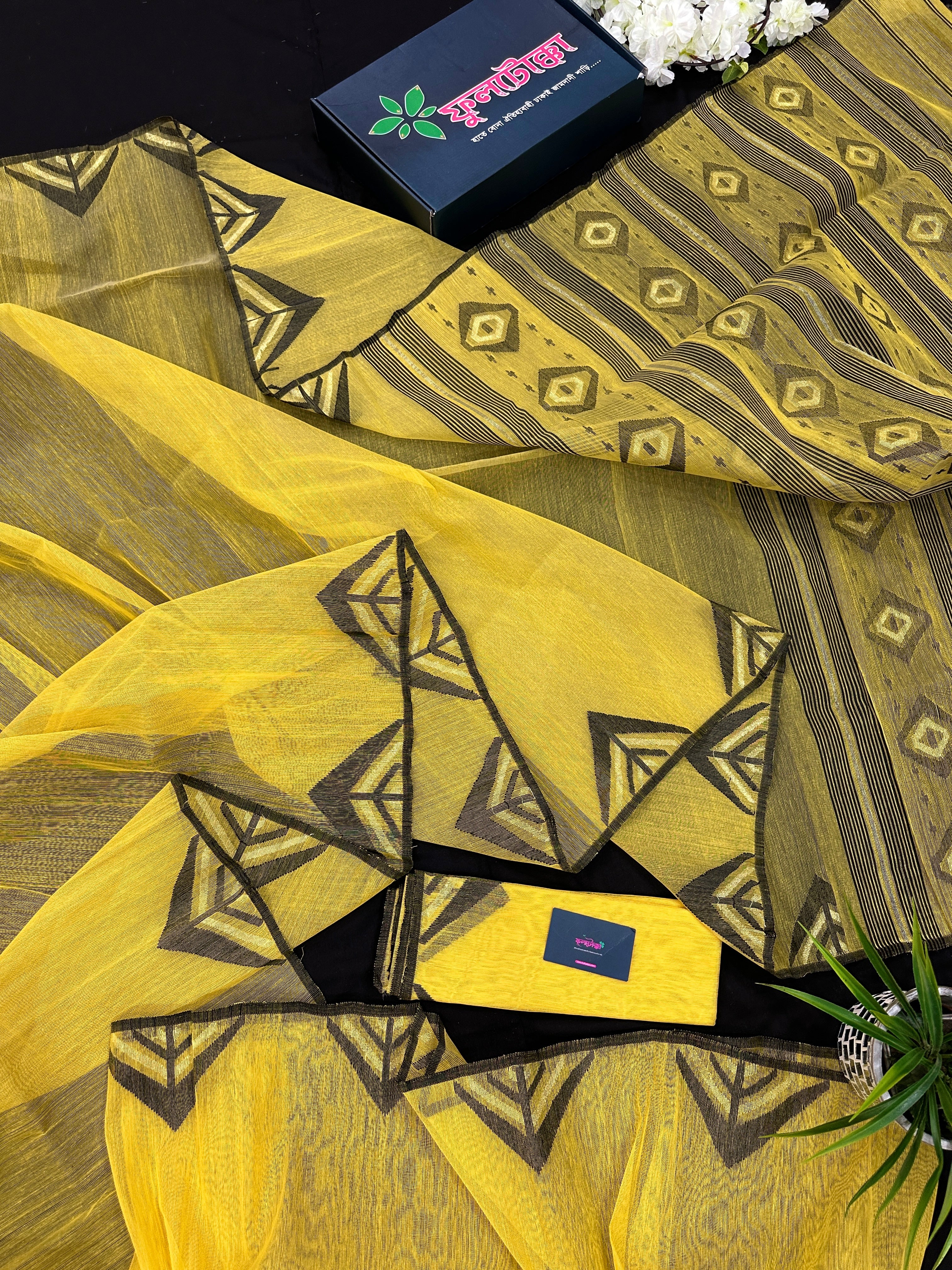 Yellow cotton jamdani sari with simple paar.