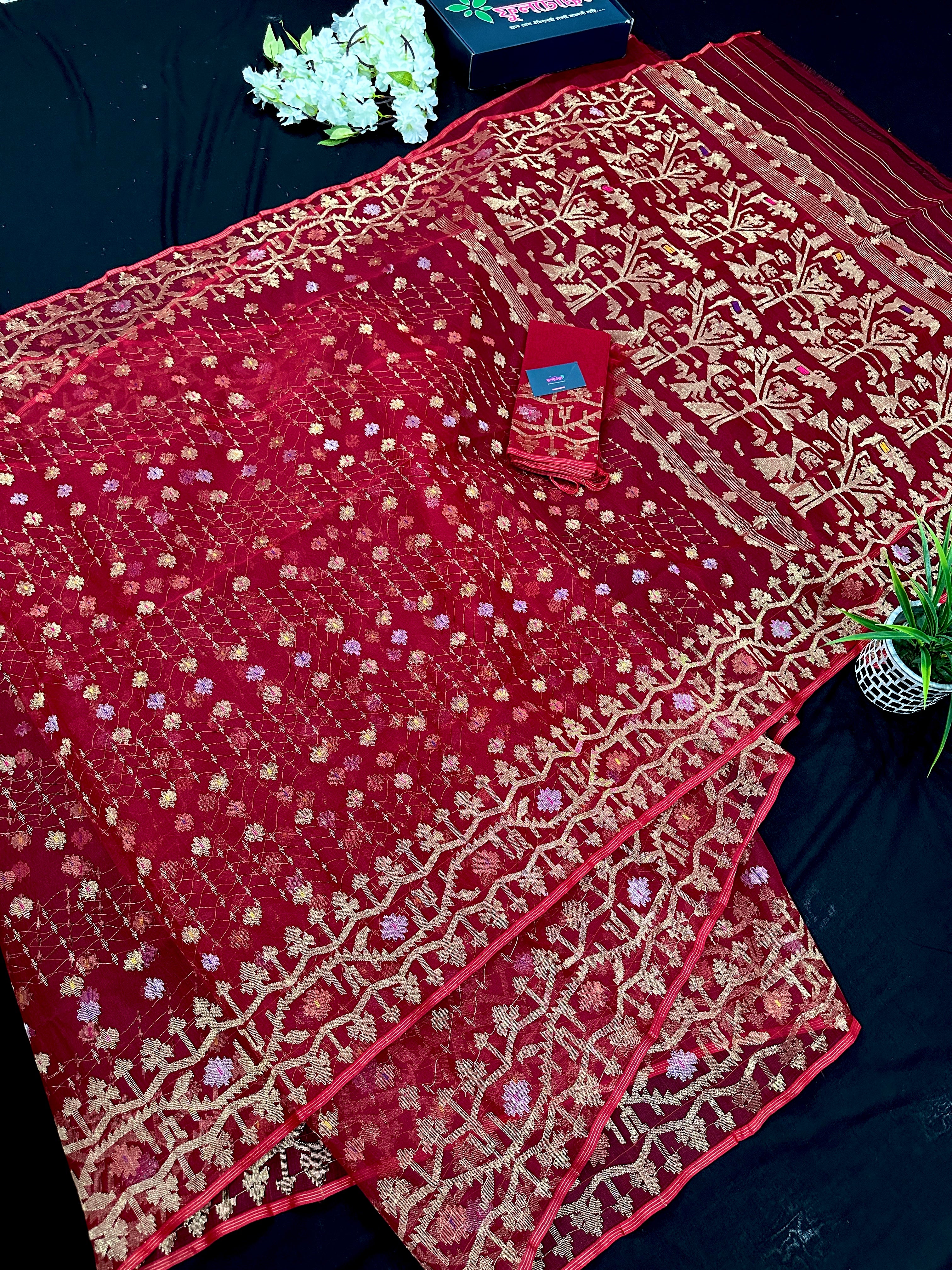 Reddish Maroon Bridal Exclusive dhakai jamdani saree with all over golden jori work soft count.