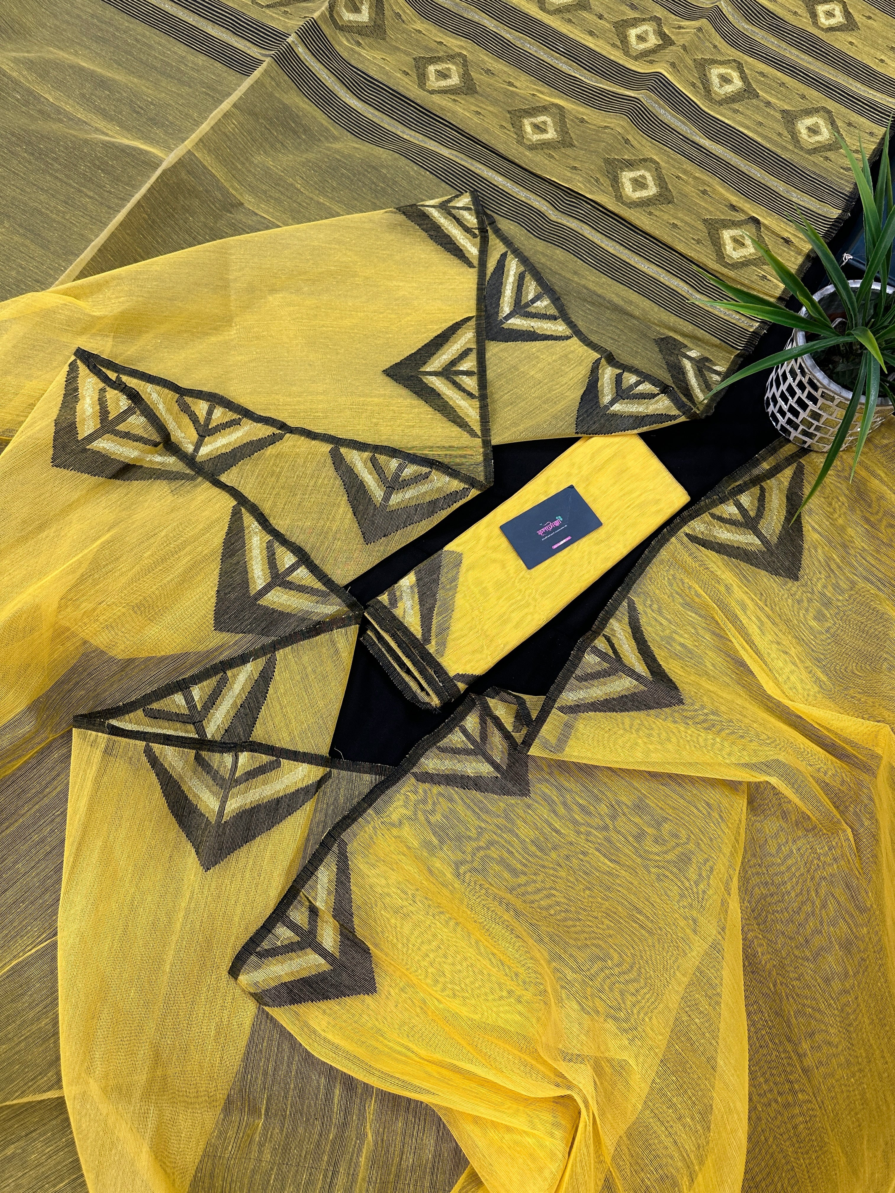 Yellow cotton jamdani sari with simple paar.