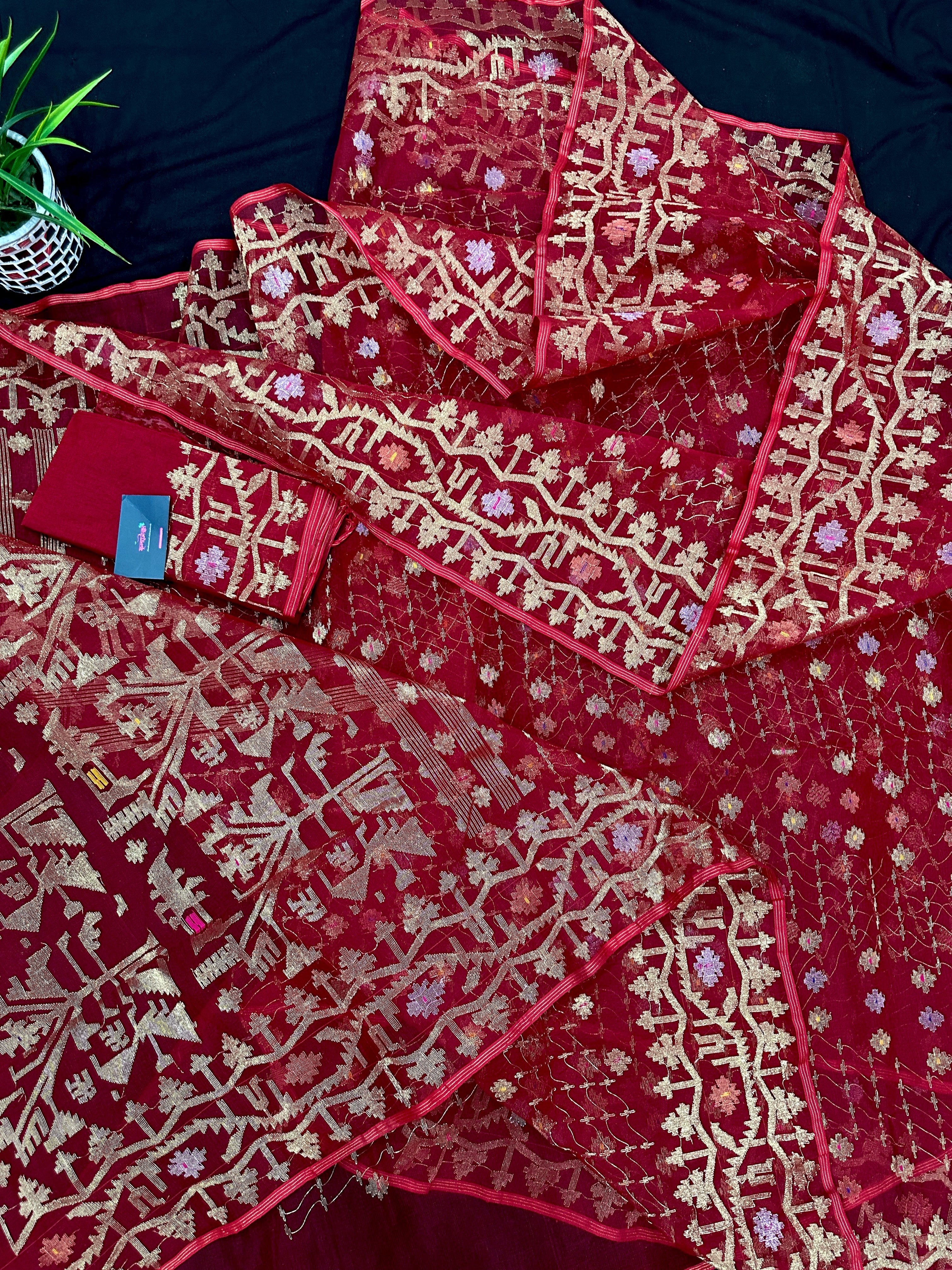 Reddish Maroon Bridal Exclusive dhakai jamdani saree with all over golden jori work soft count.