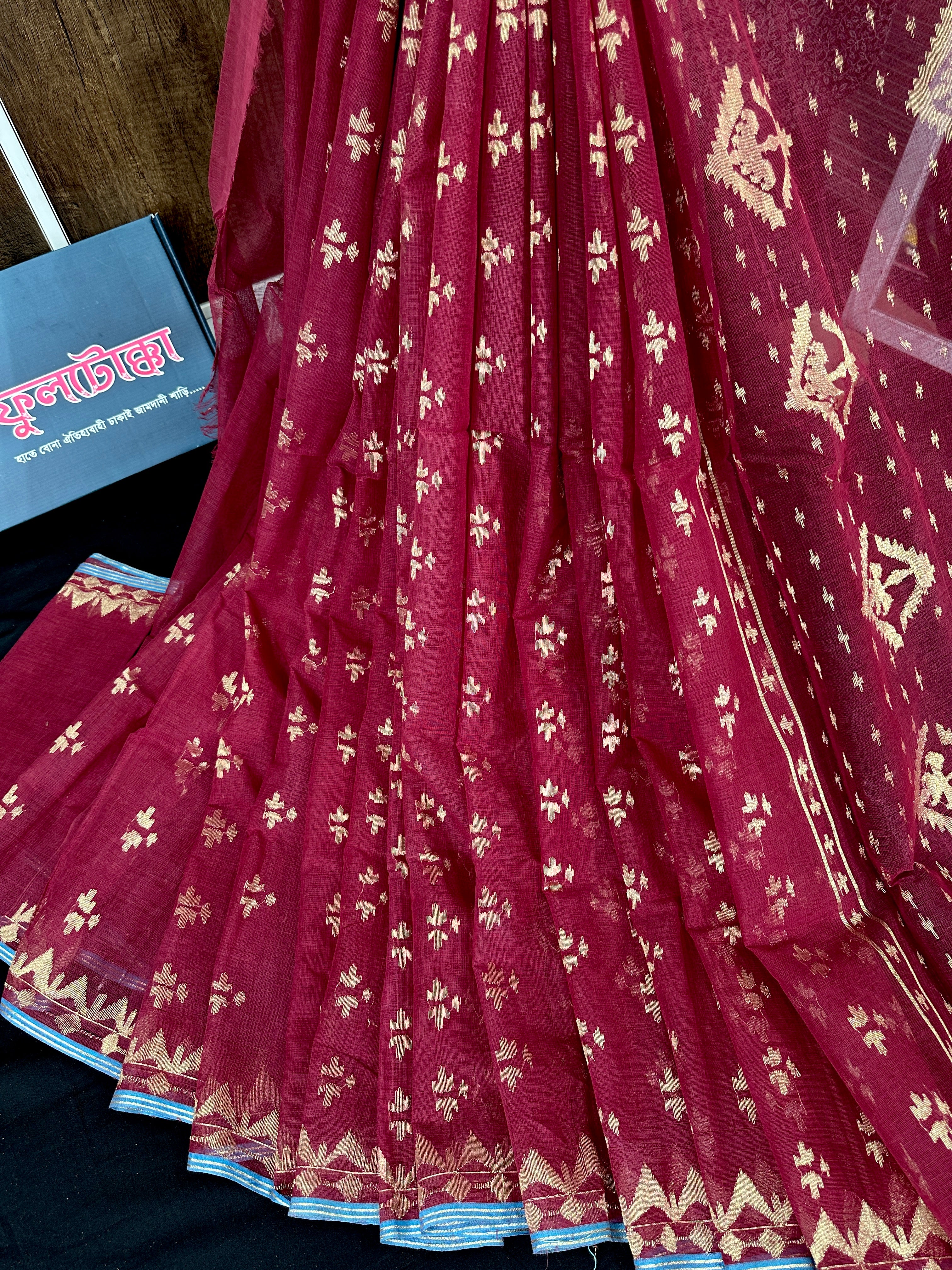 Maroon cotton jamdani saree with golden jori work and blouse piece.