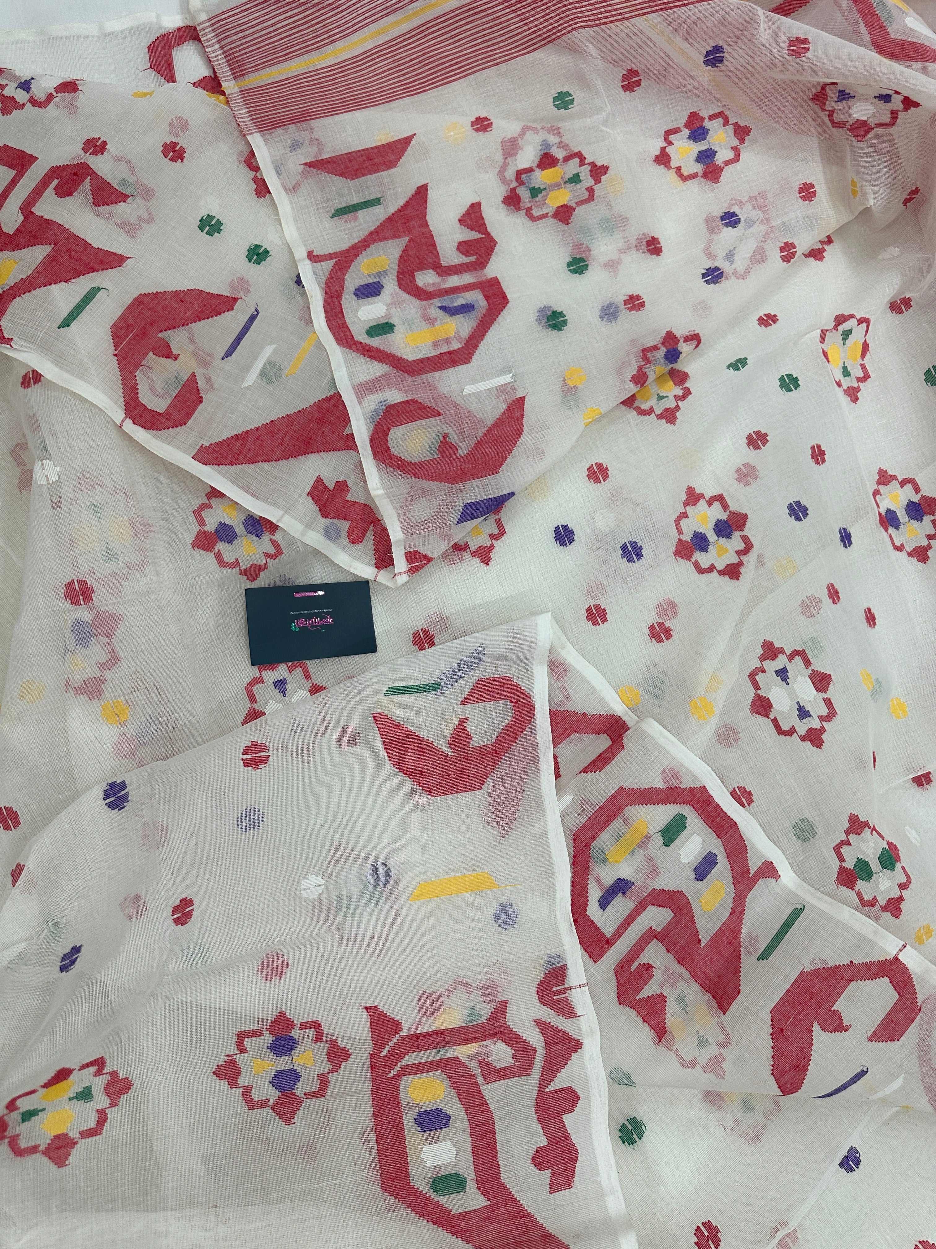 White cotton jamdani saree with multiple colour threads work and blouse piece.