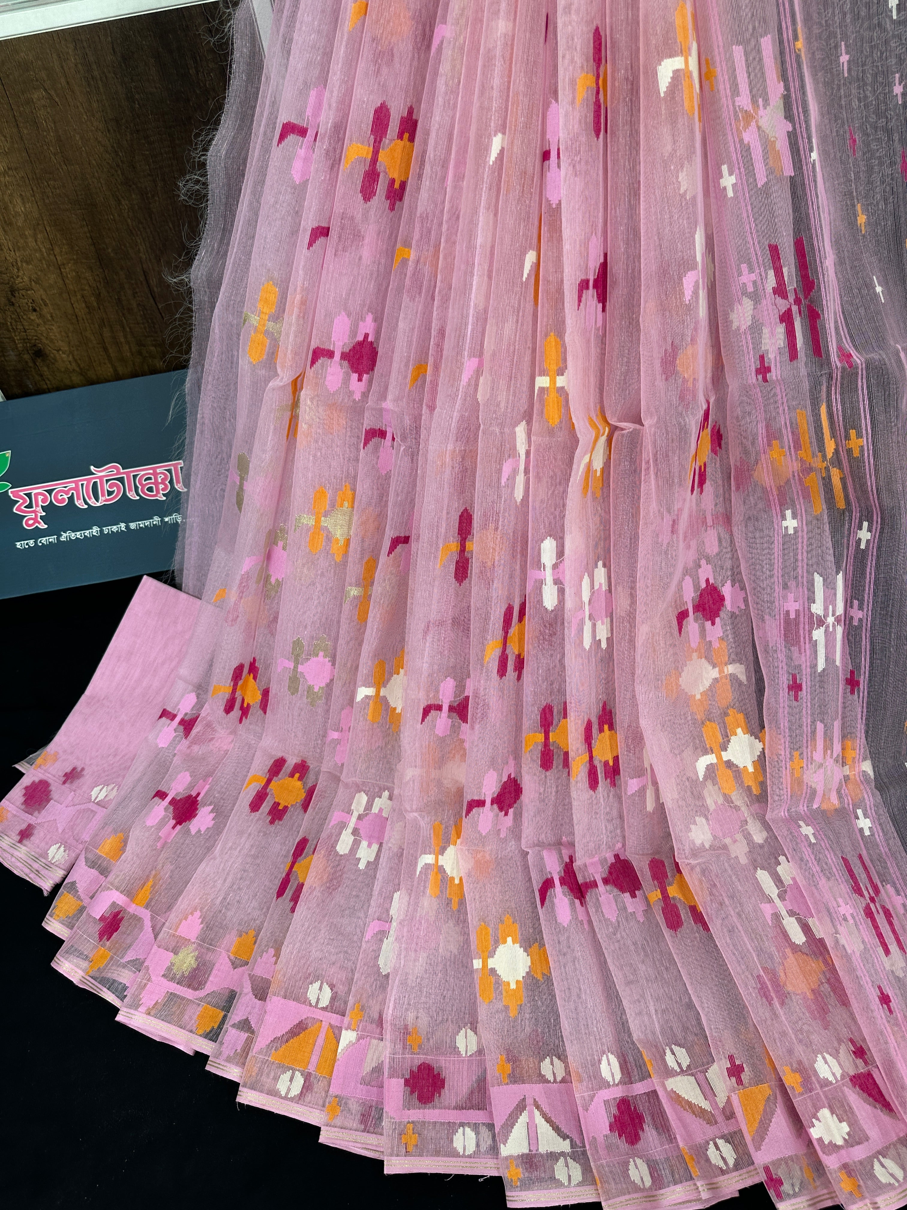 Baby pink halfsilk jamdani saree with white orange pink threads work