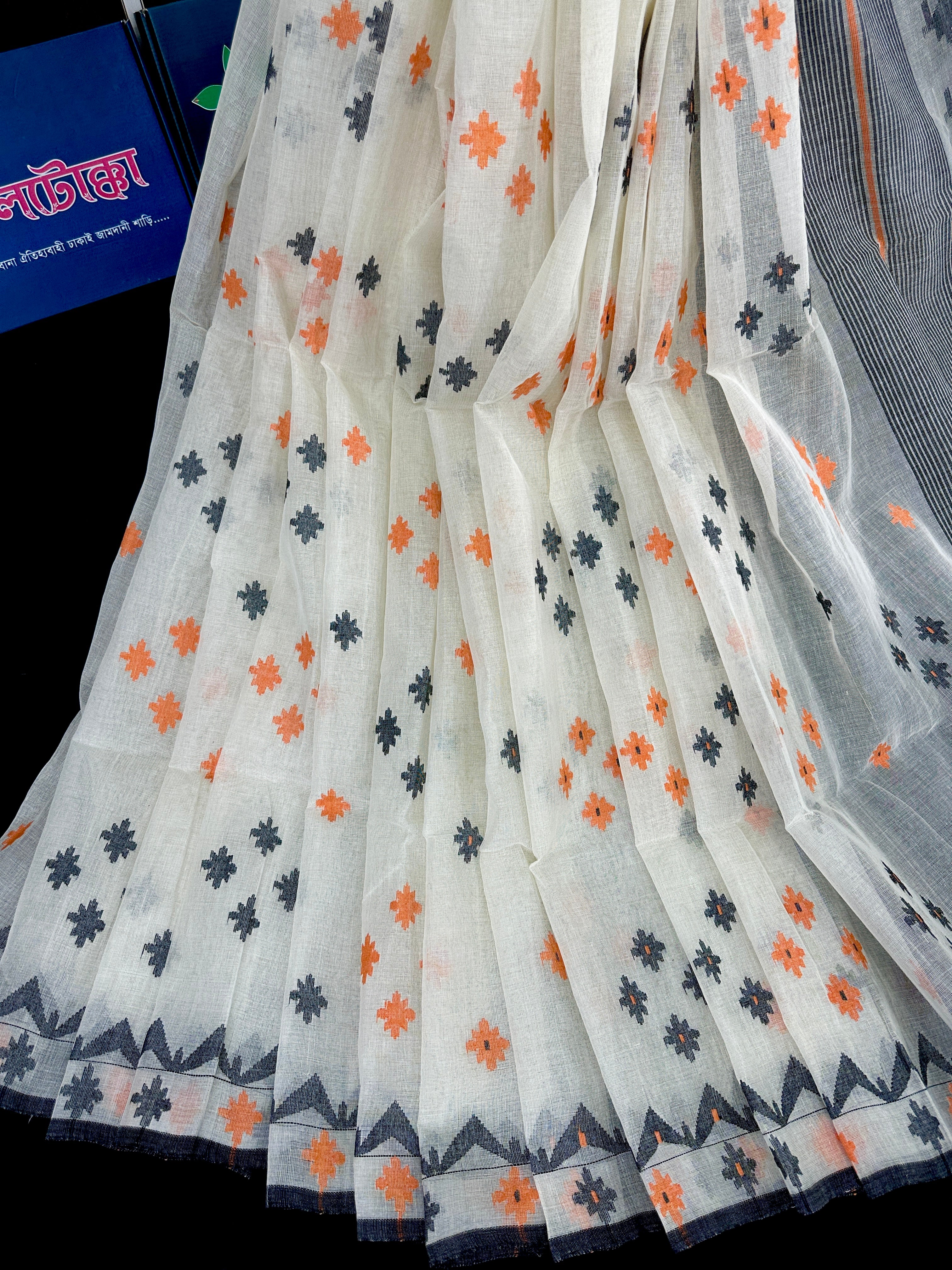 White cotton jamdani saree with orange & black threads work.