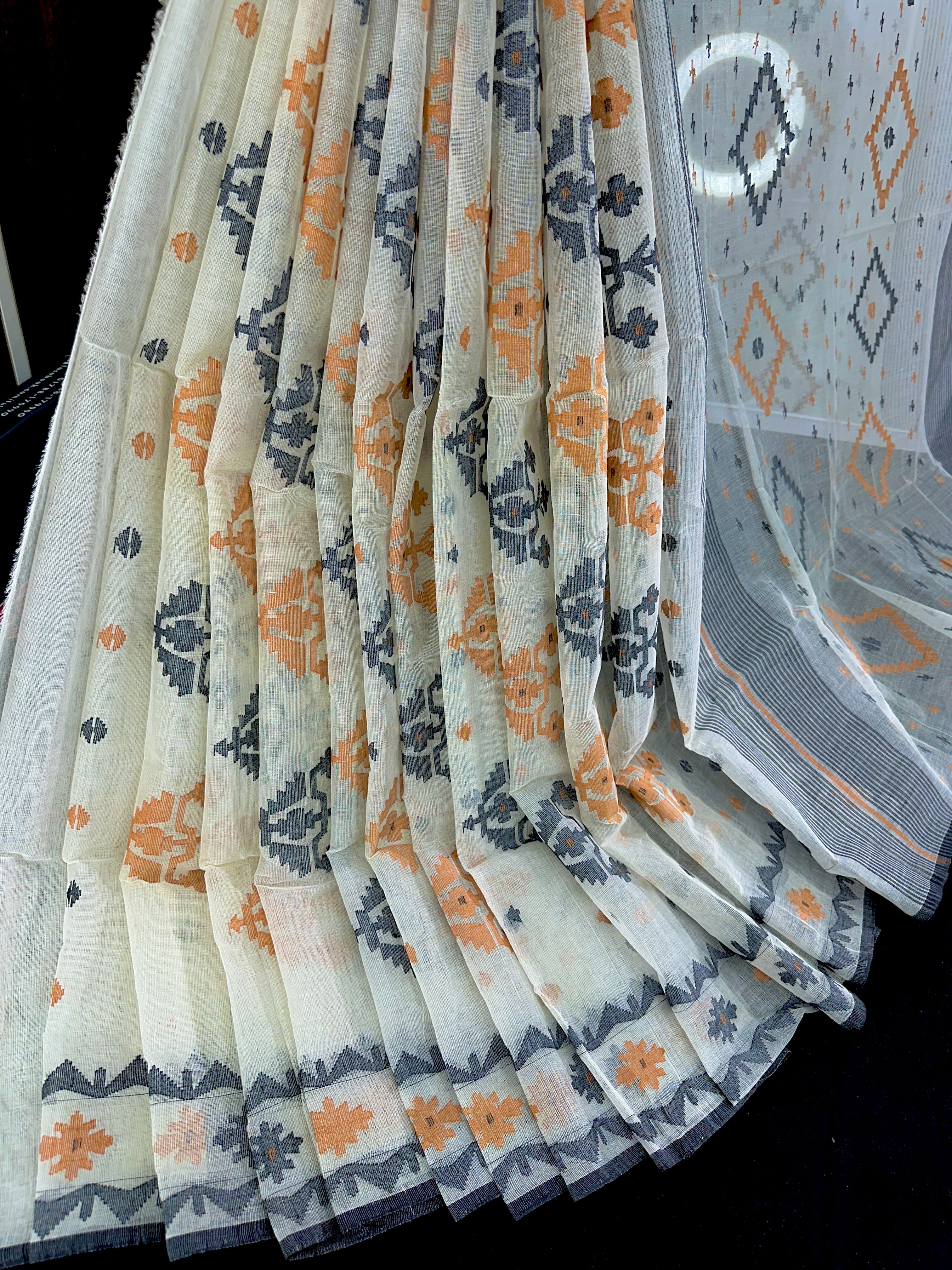 White cotton jamdani saree with orange black floral threads work