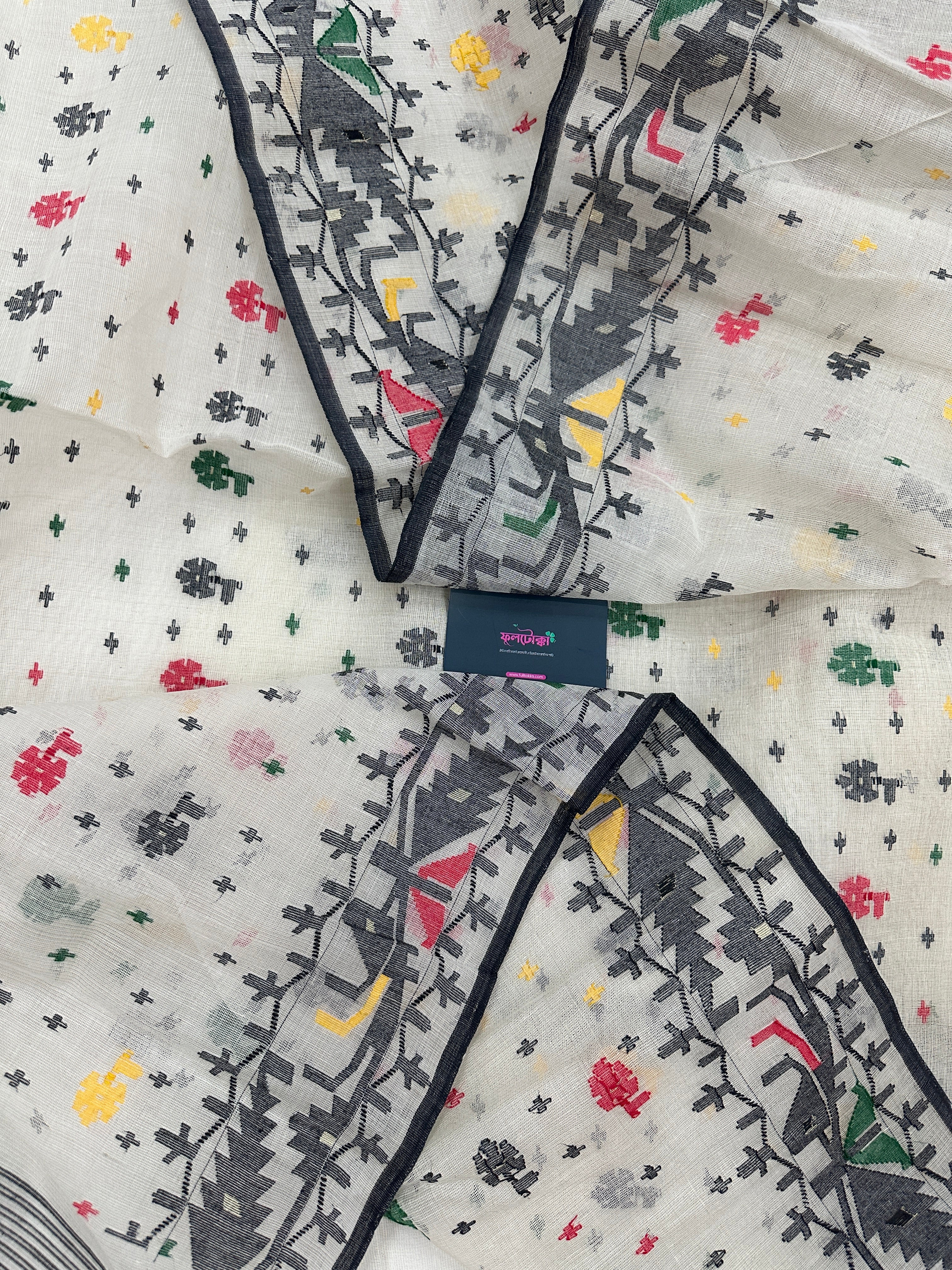 White cotton jamdani saree with black red yellow green threads work & blouse piece.