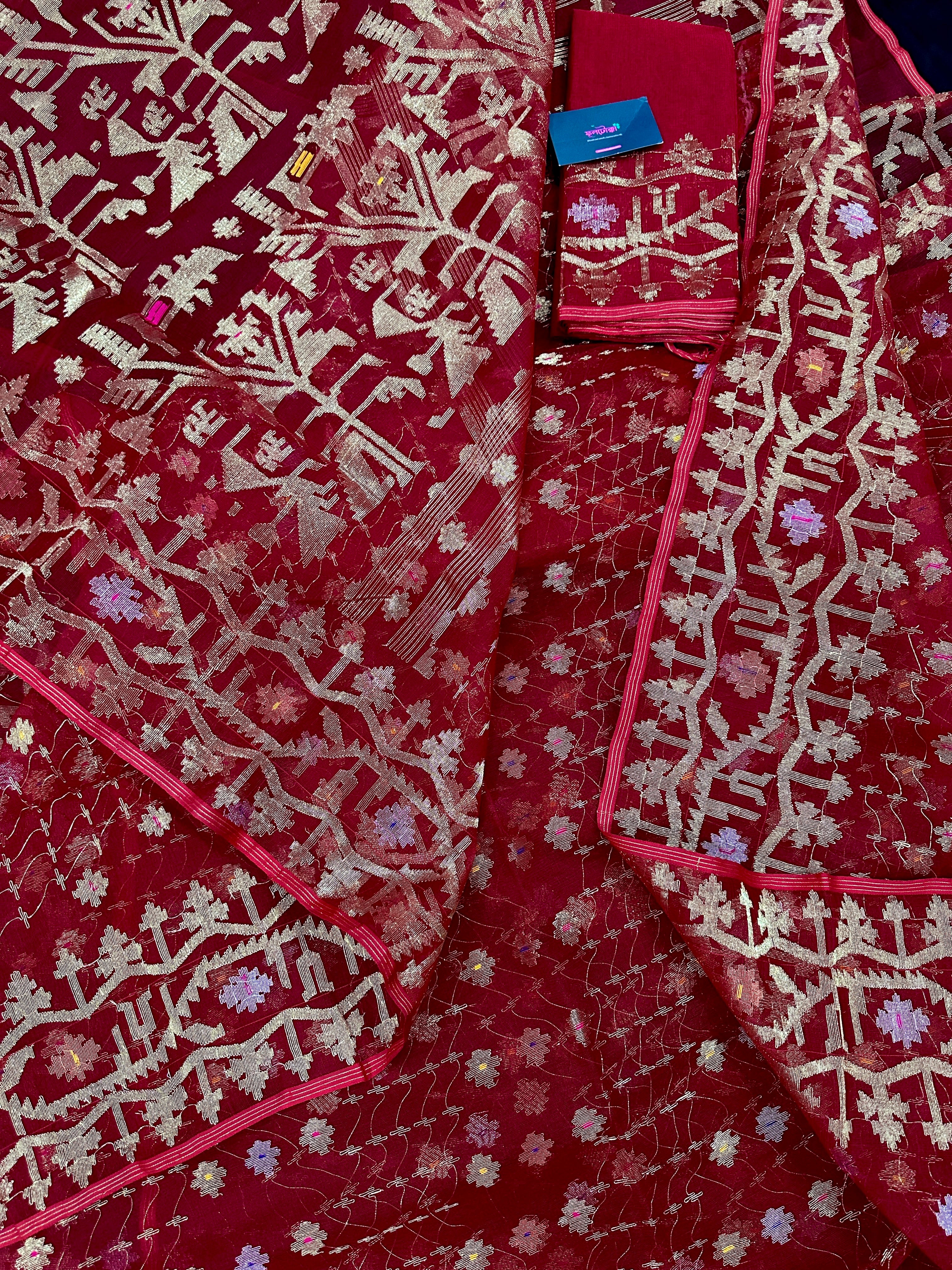 Reddish Maroon Bridal Exclusive dhakai jamdani saree with all over golden jori work soft count.