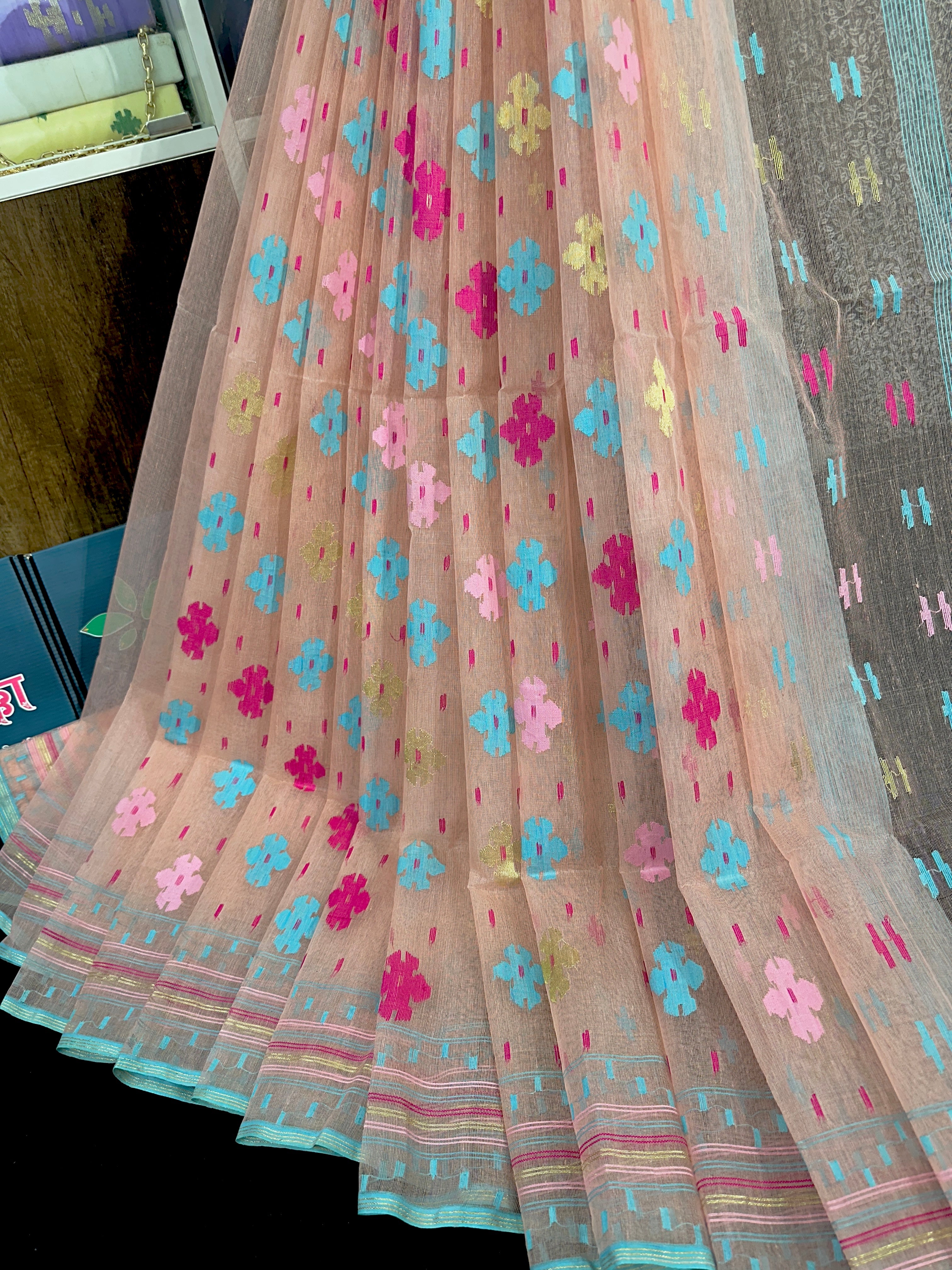 Peach colour halfsilk jamdani saree with blue pink golden magenta threads work