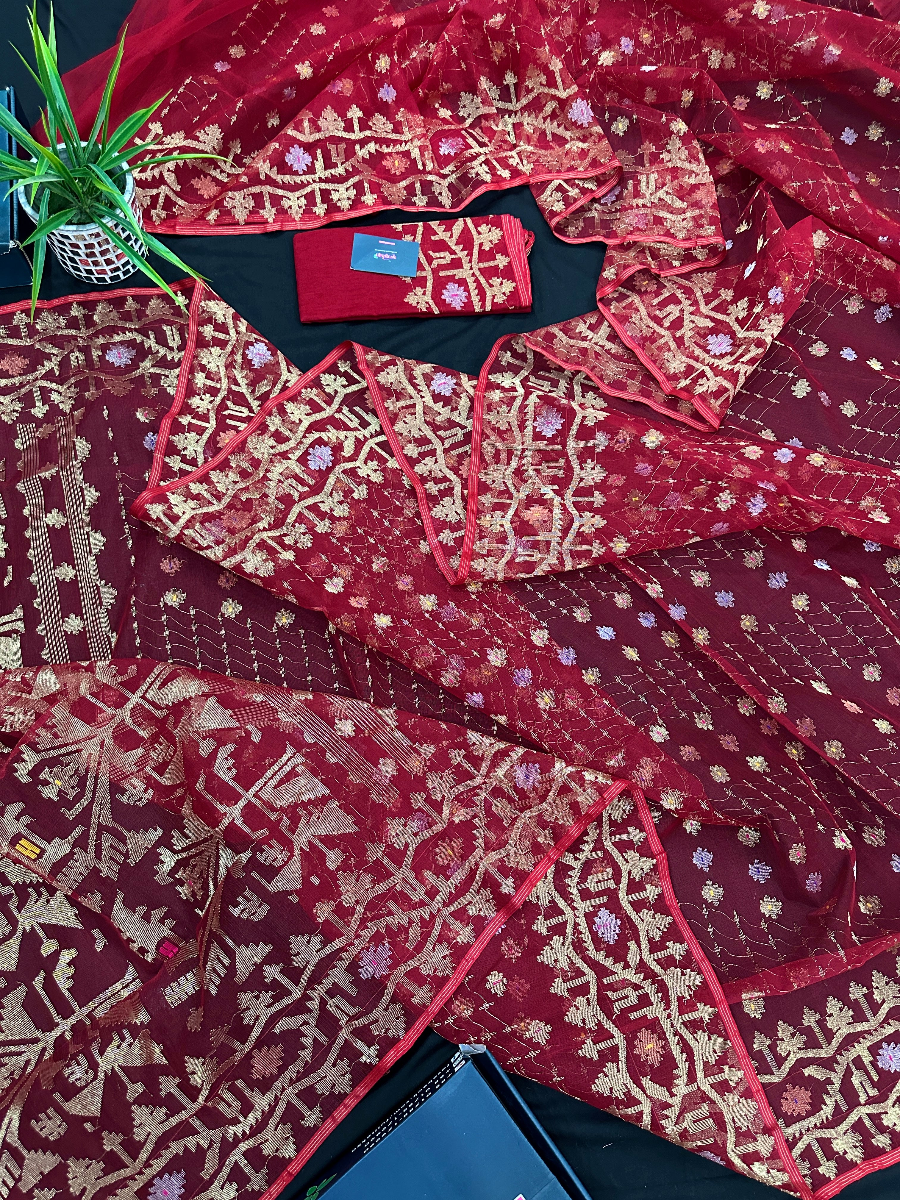 Reddish Maroon Bridal Exclusive dhakai jamdani saree with all over golden jori work soft count.