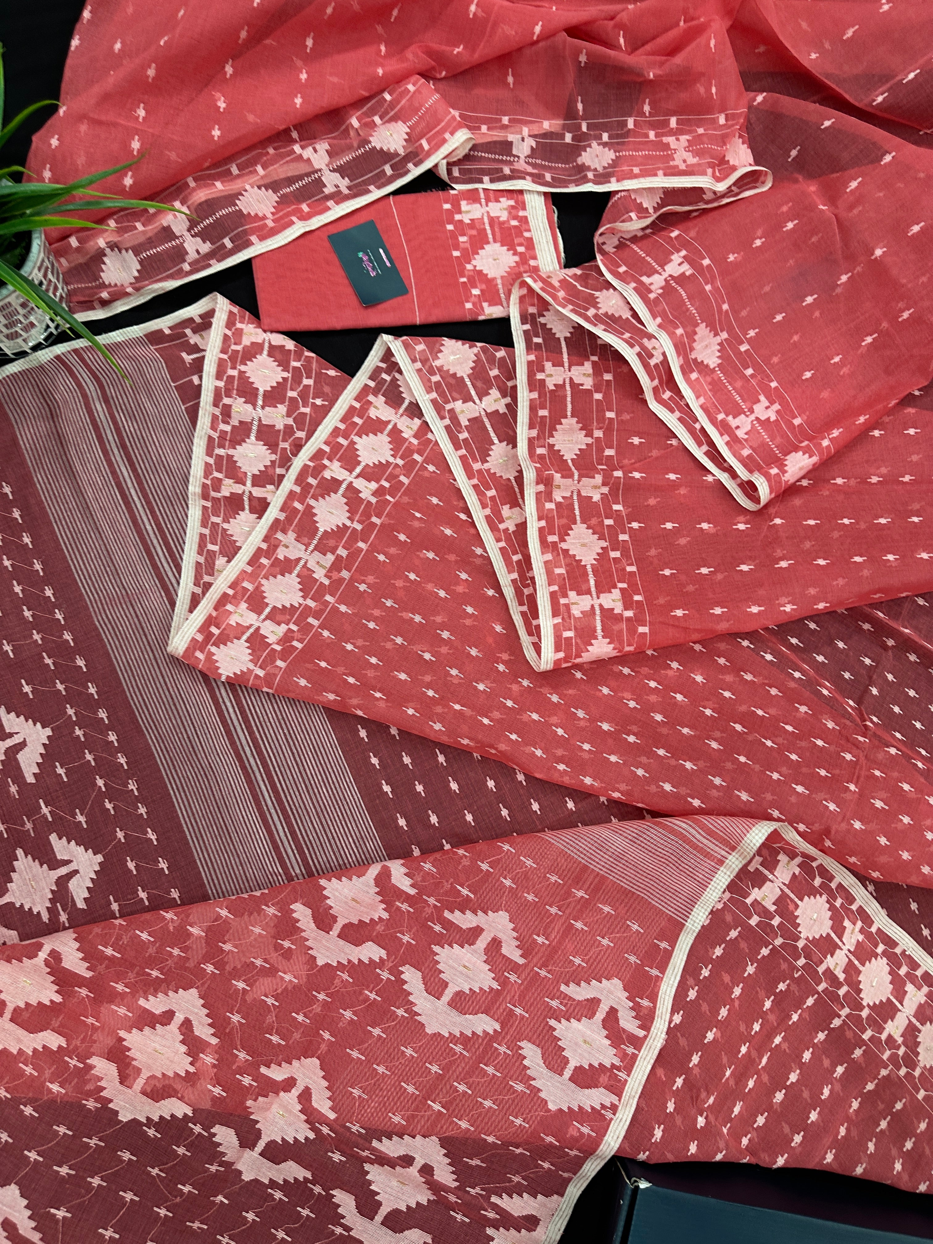 Sweet pink cotton jamdani saree with white threads work and blouse piece.