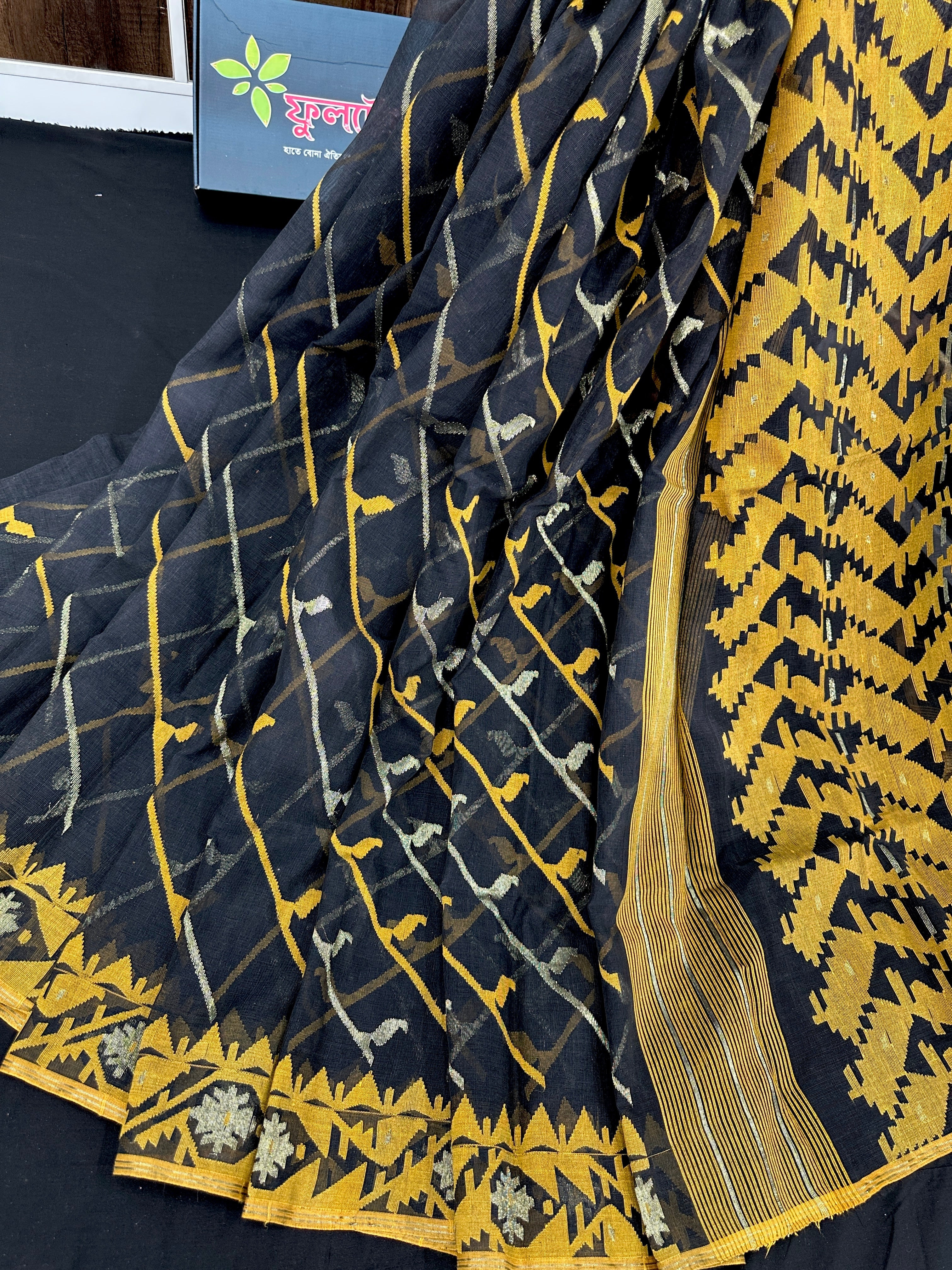 Black cotton jamdani saree with yellow threads work and Silver jori work & blouse piece.