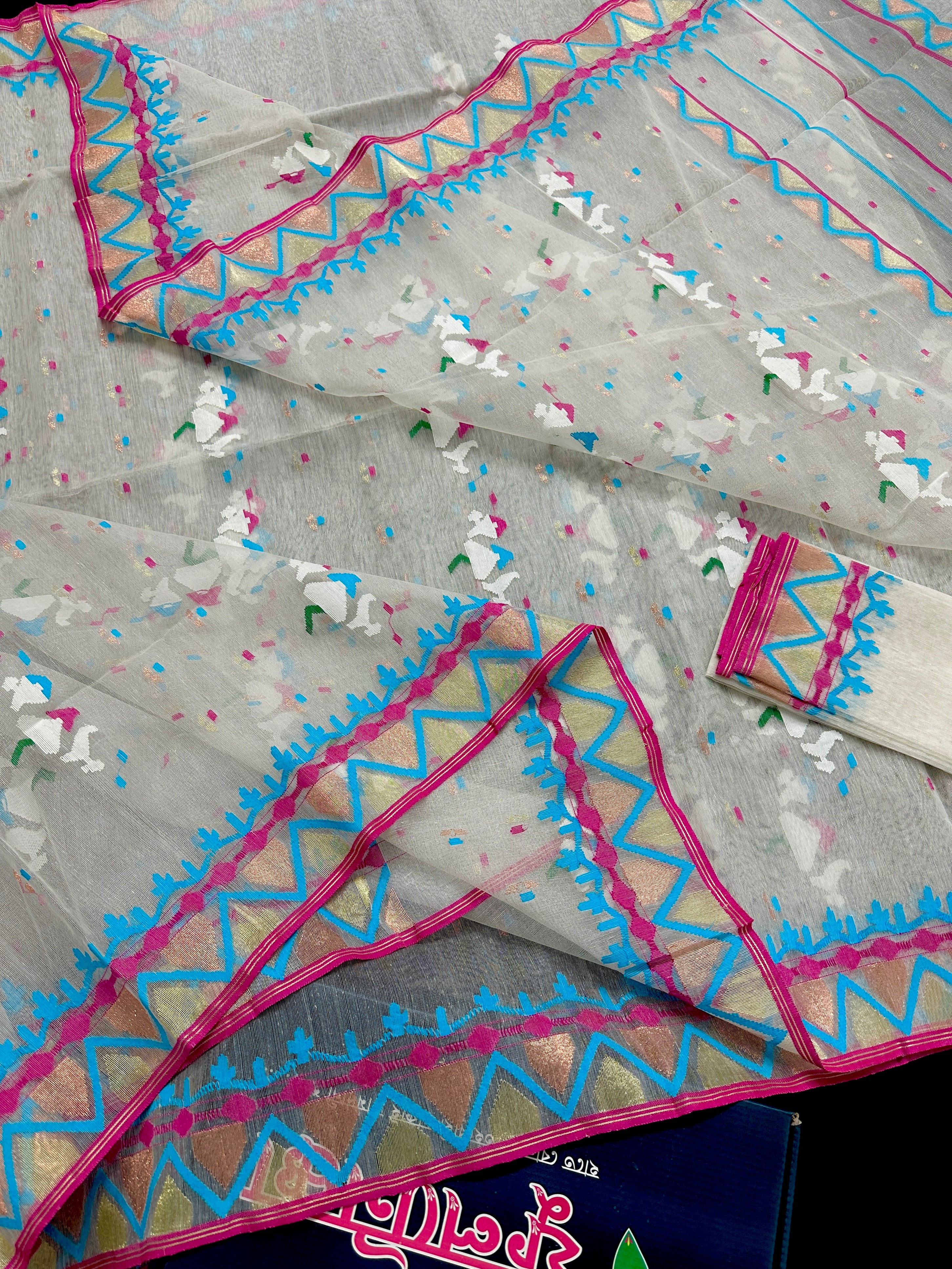 White halfsilk jamdani saree with pink border white blue threads work and copper jori work
