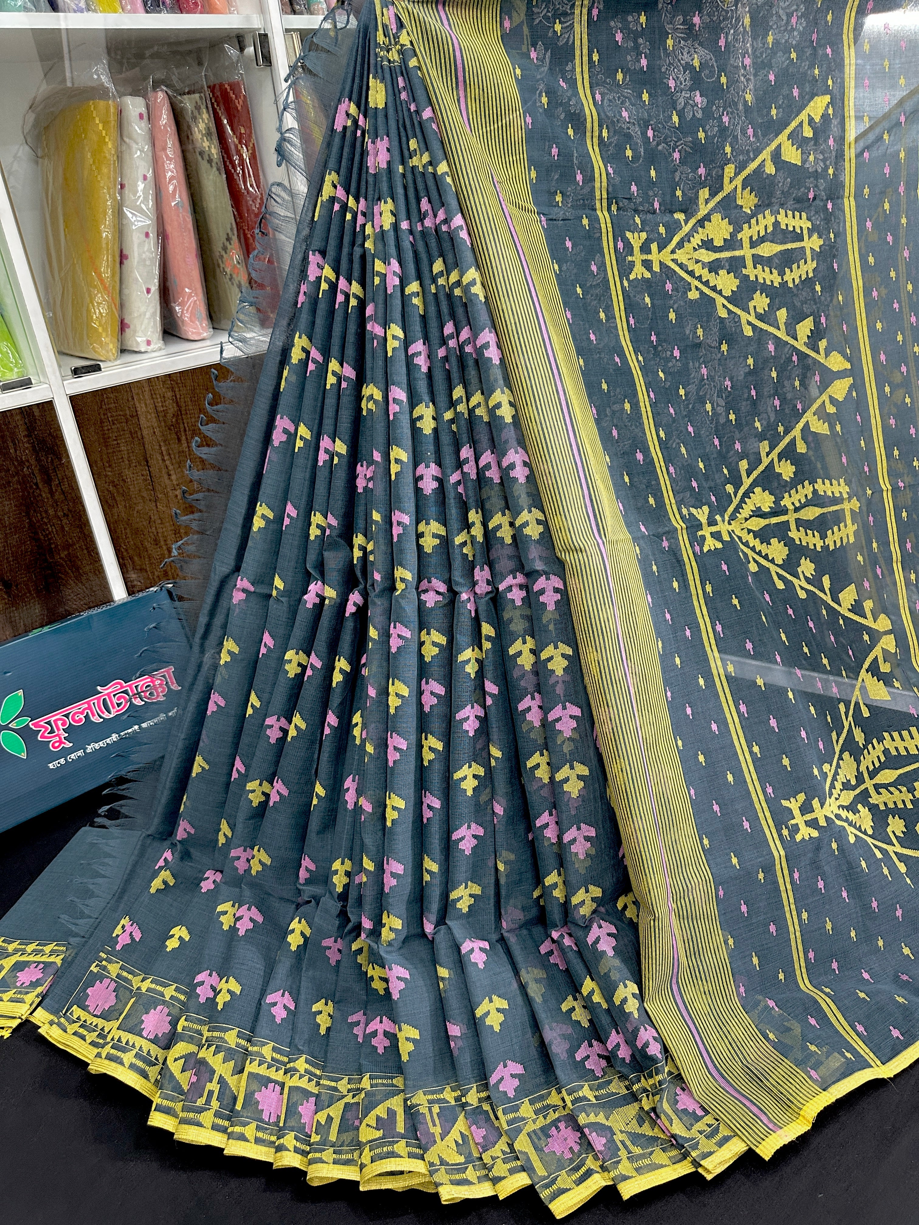 Ash blue cotton jamdani saree with yellow pink threads work