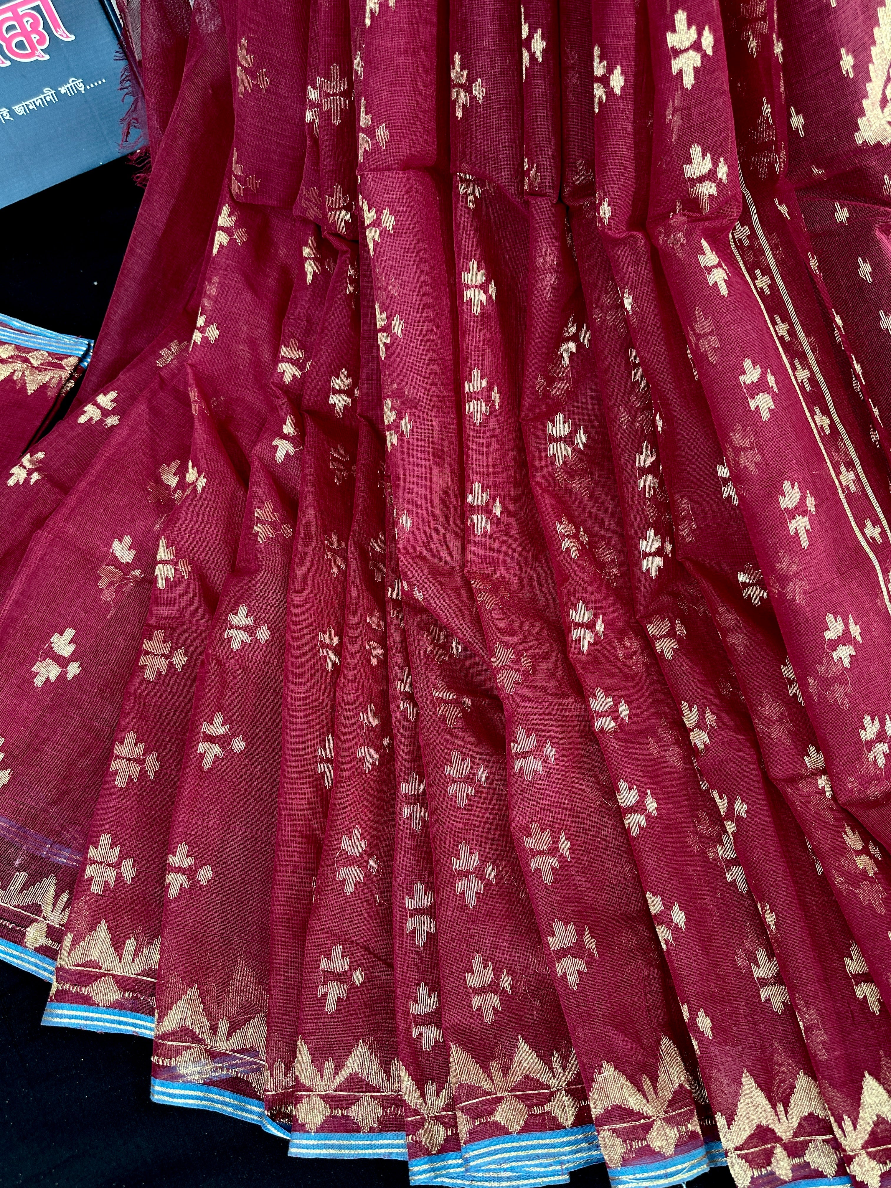 Maroon cotton jamdani saree with golden jori work and blouse piece.