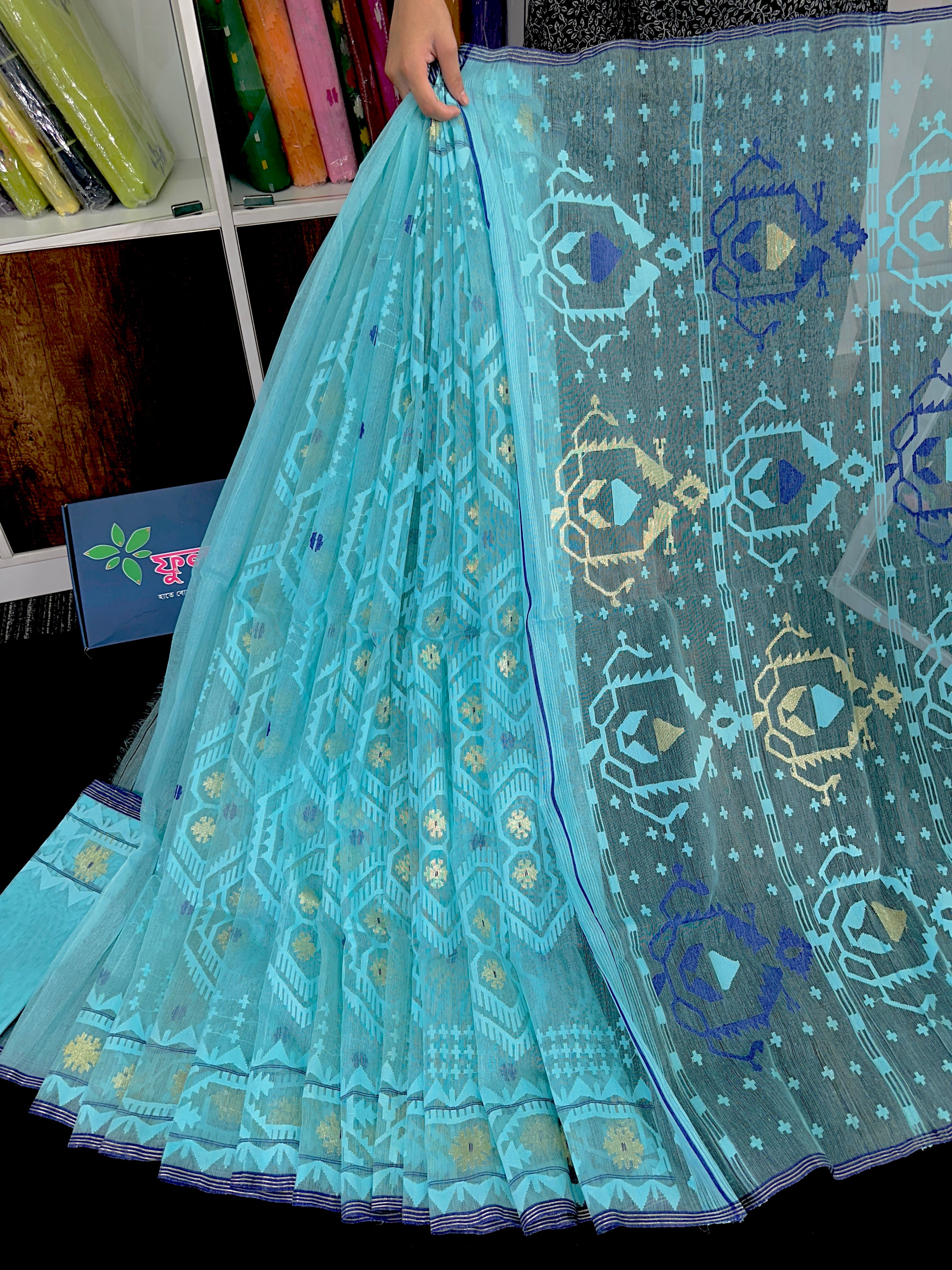 Cyan blue exclusive halfsilk jamdani saree with golden jori work and self threads work.