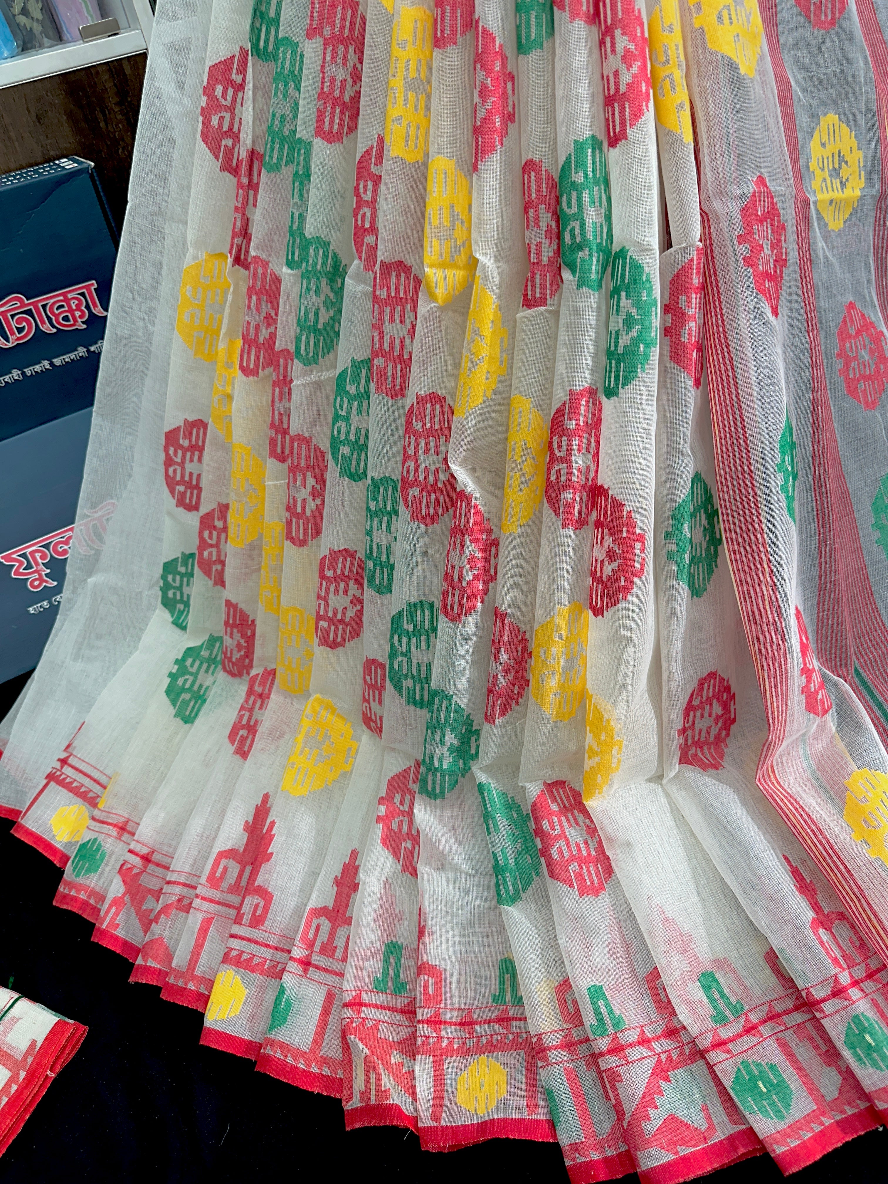 White cotton jamdani saree with red yellow green threads work multiple colour threads work