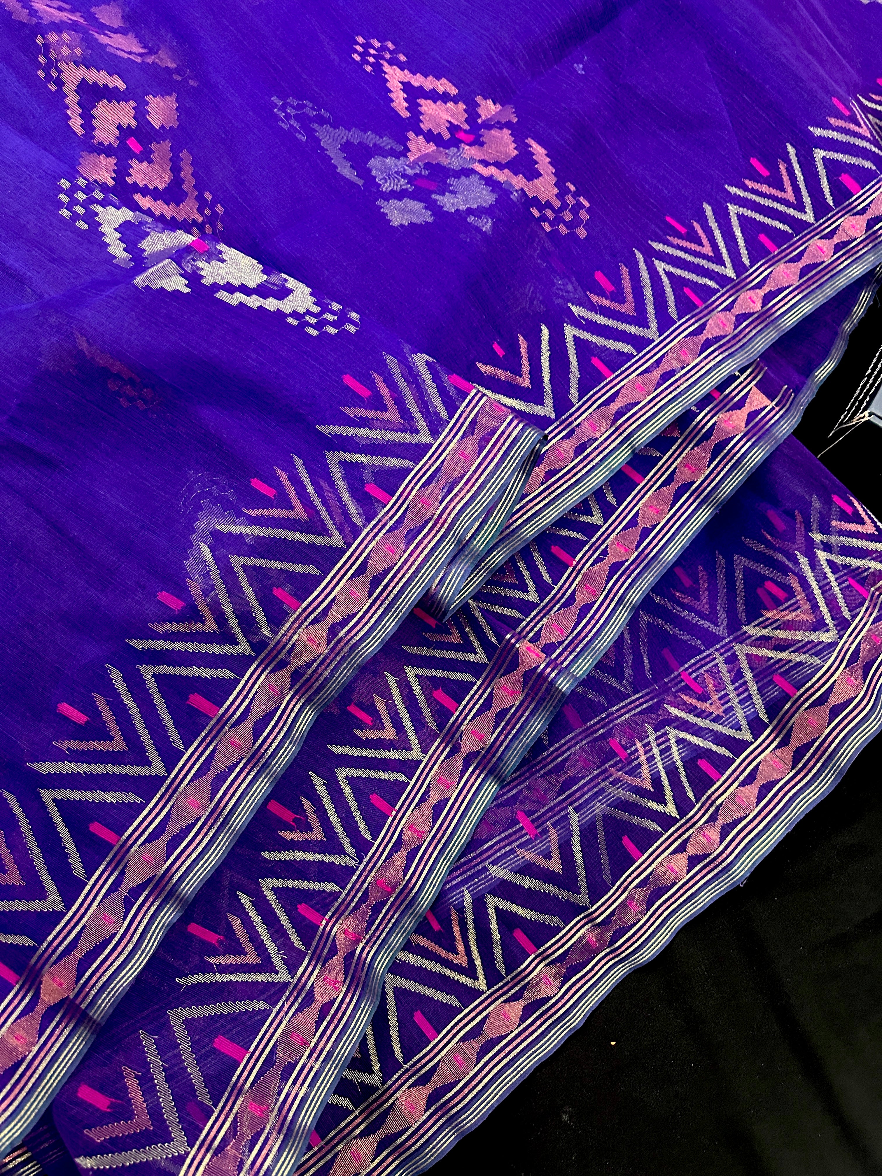 Purple exclusive jamdani saree with golden silver and copper jori work.