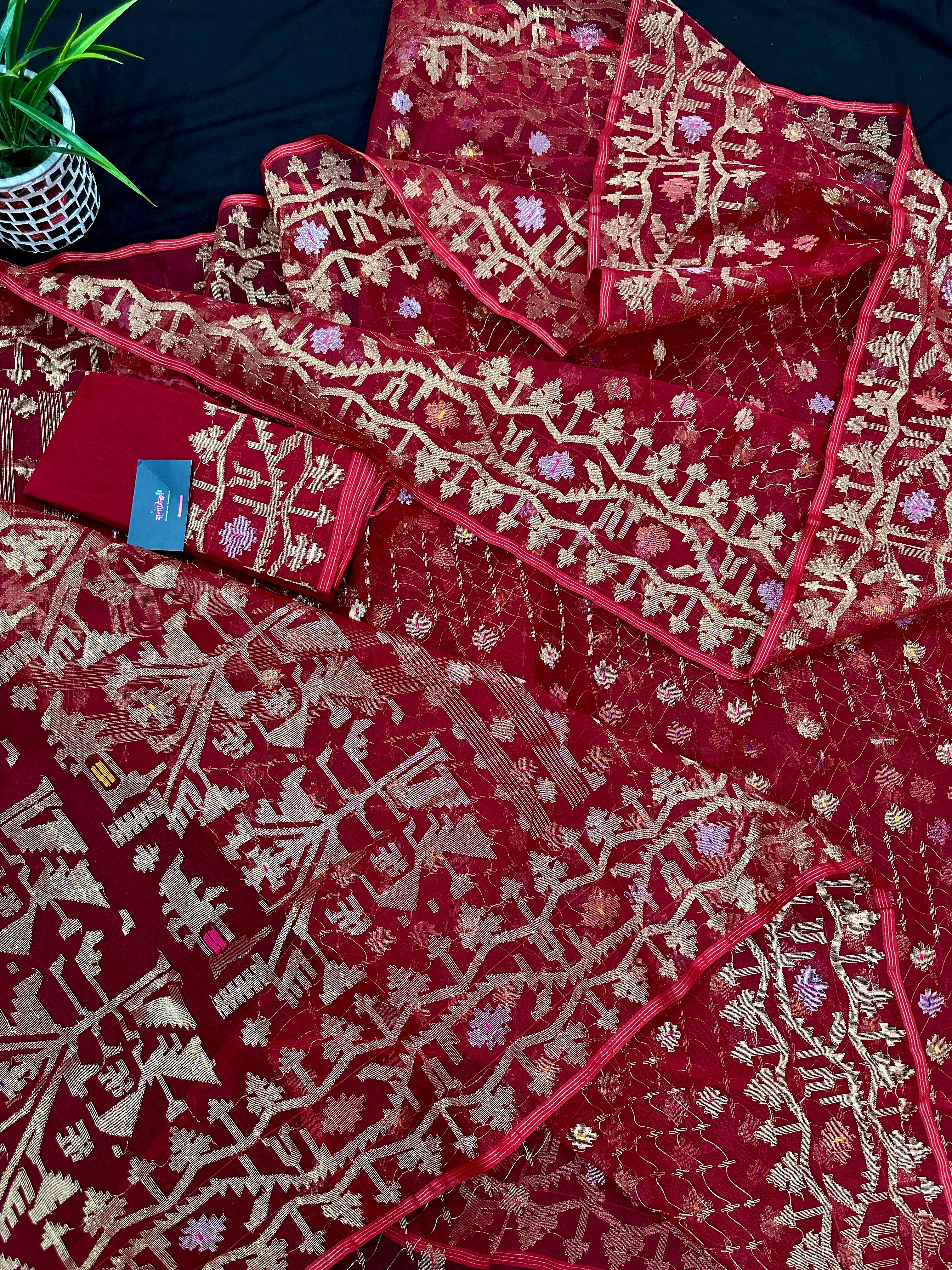 Reddish Maroon Bridal Exclusive dhakai jamdani saree with all over golden jori work soft count.
