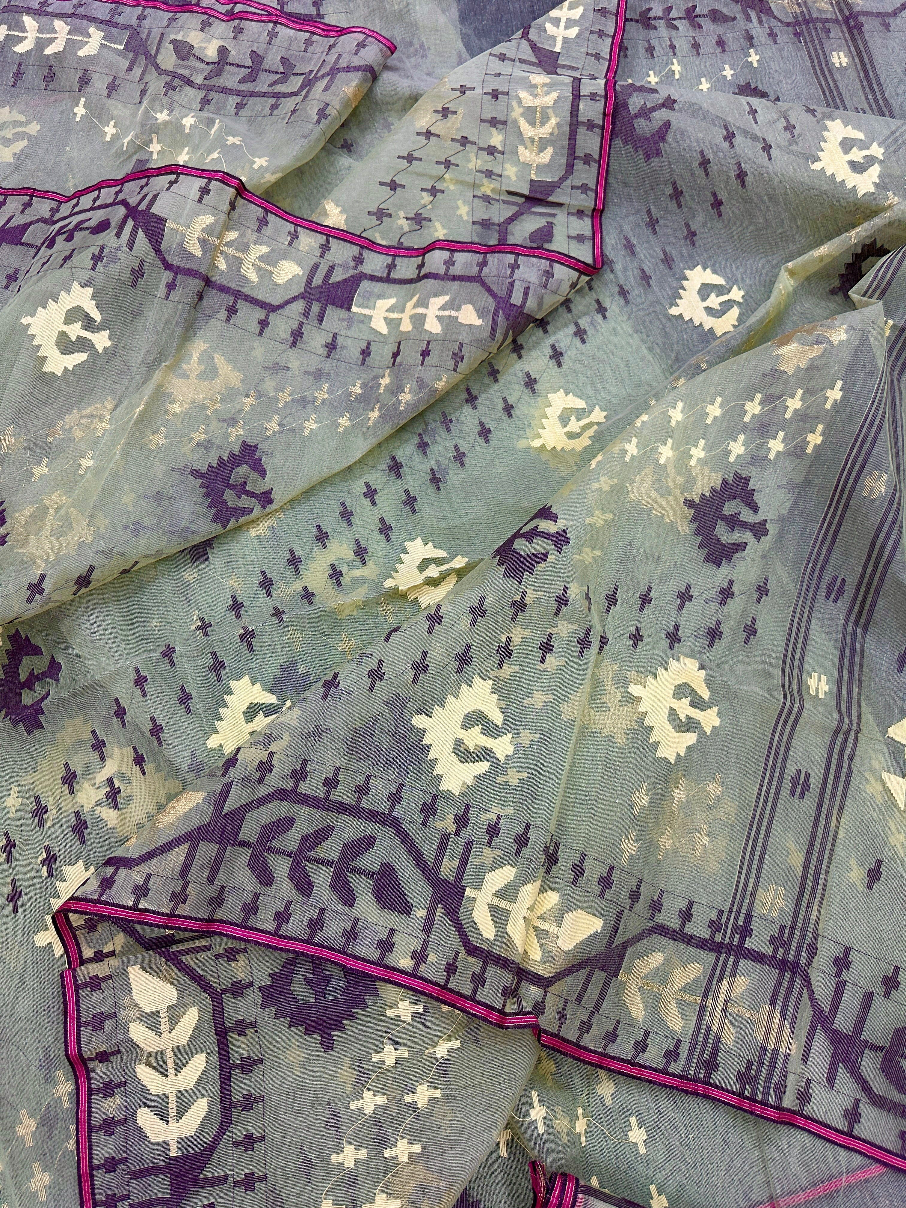 Pear green type Lite mint jamdani saree with threads work.
