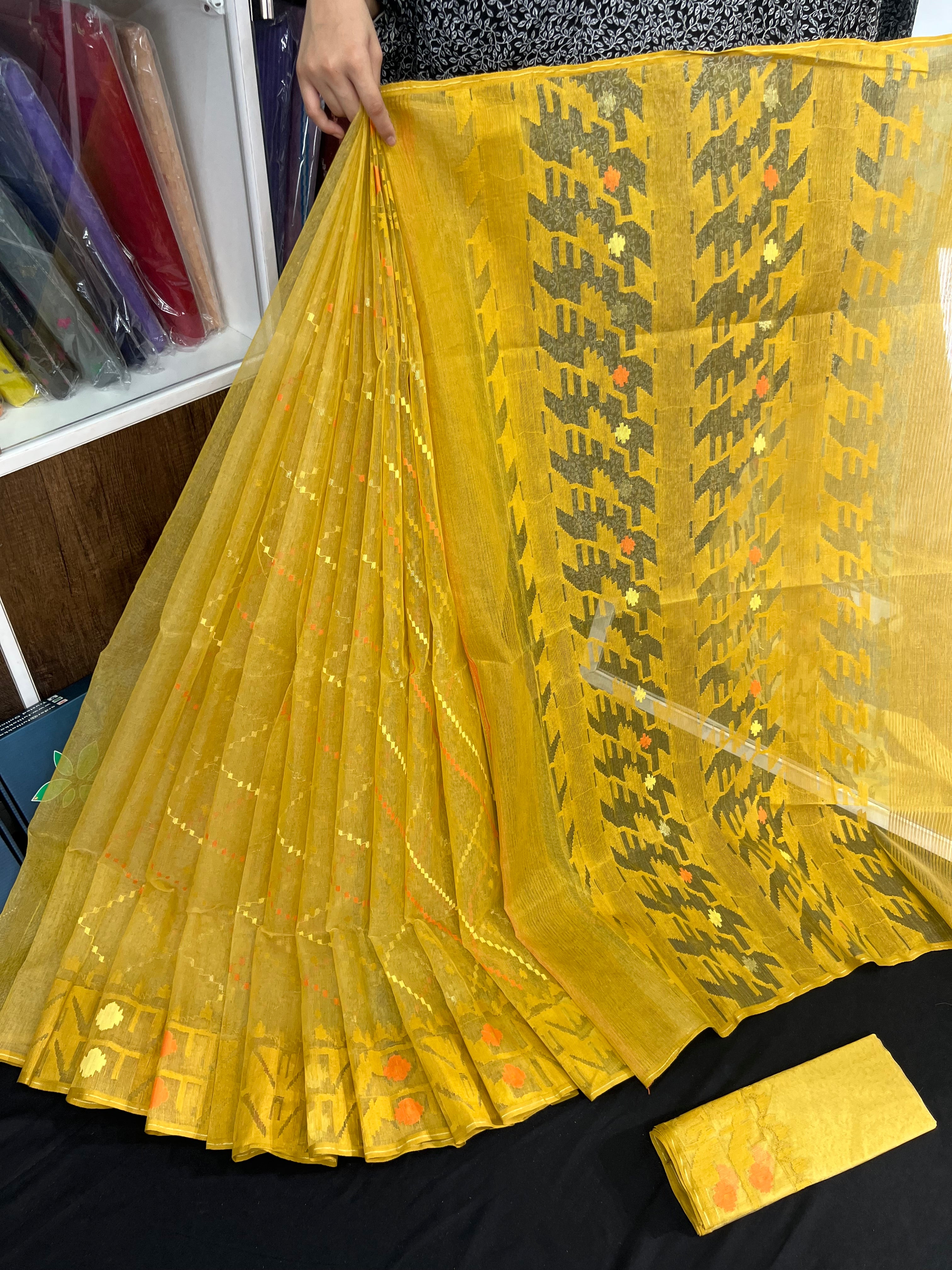 Yellow halfsilk jamdani saree with yellow orange threads work