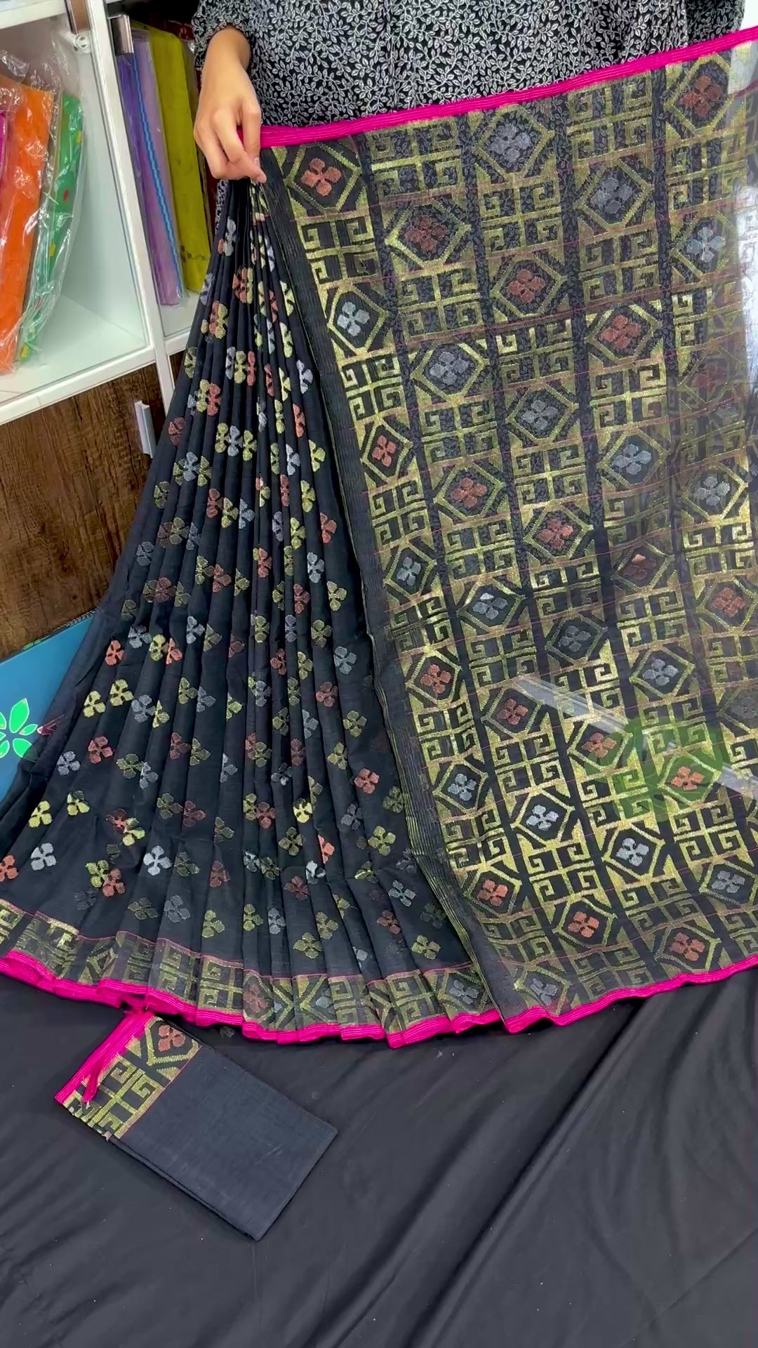 Black jamdani saree with golden silver and copper jori work and pink border
