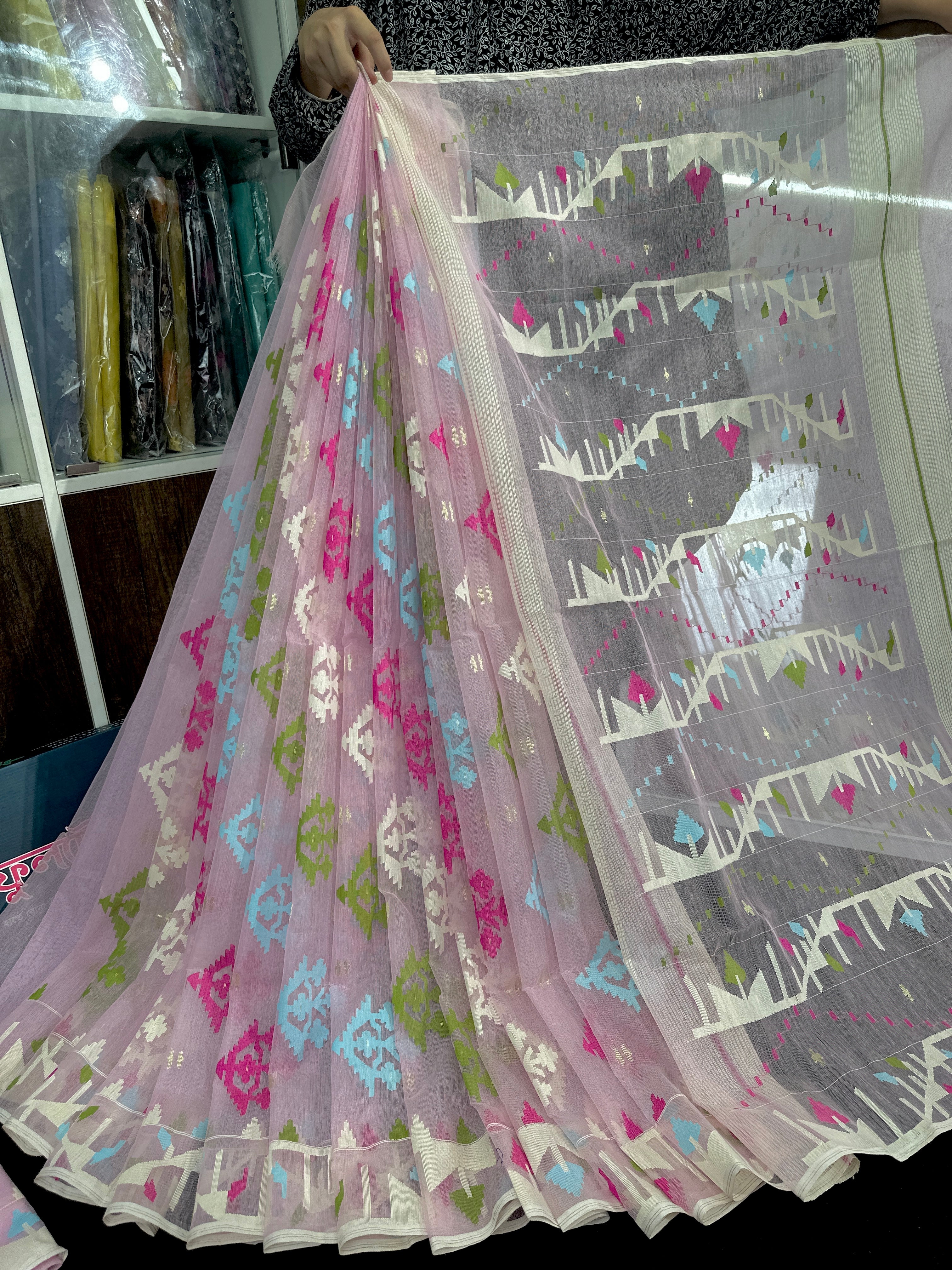 Baby pink halfsilk jamdani saree with blue magenta green off white threads work