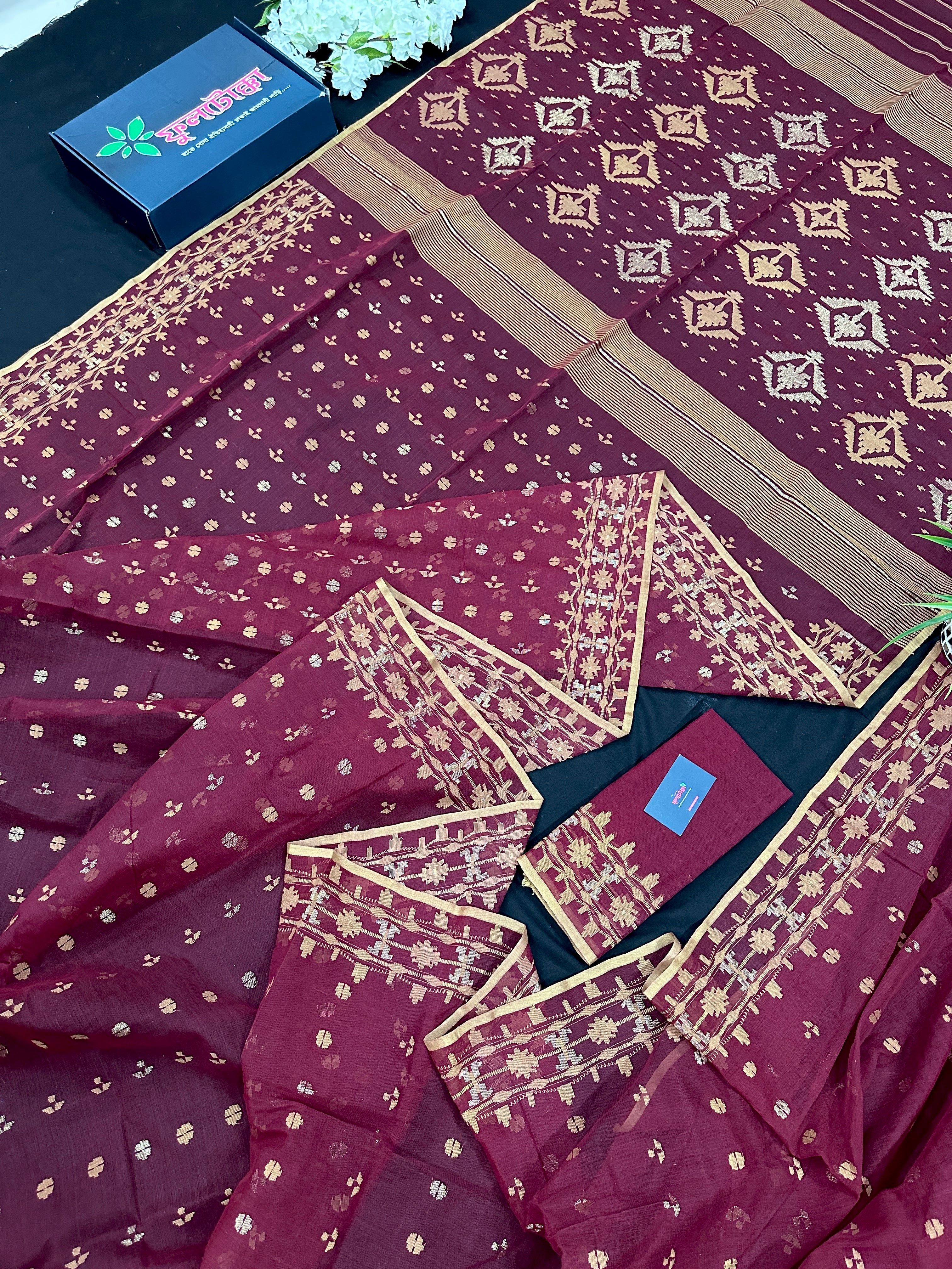 Maroon cotton jamdani with yellowish threads work.