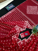 Maroon jamdani saree with white thread work.