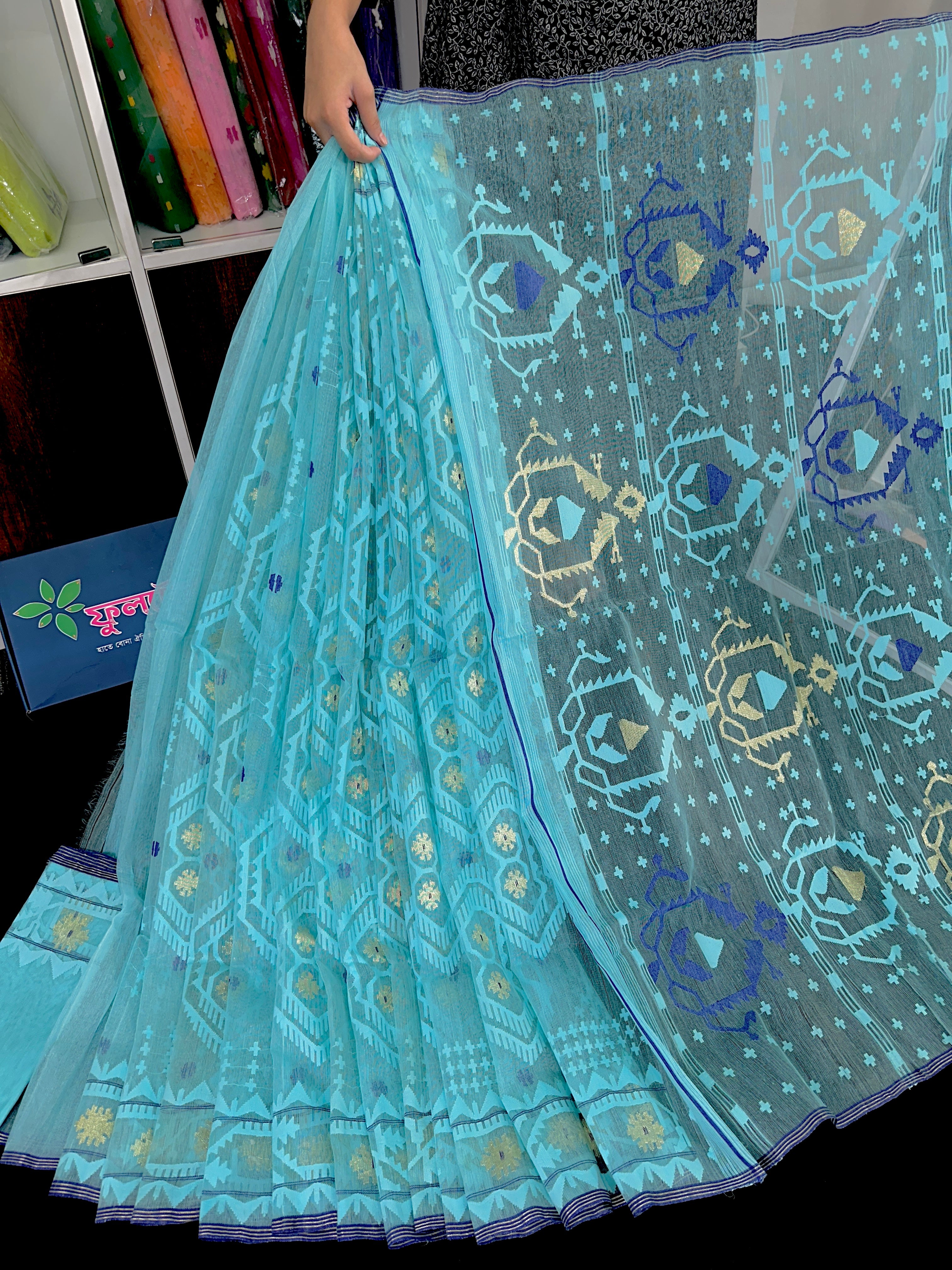 Cyan blue exclusive halfsilk jamdani saree with golden jori work and self threads work.