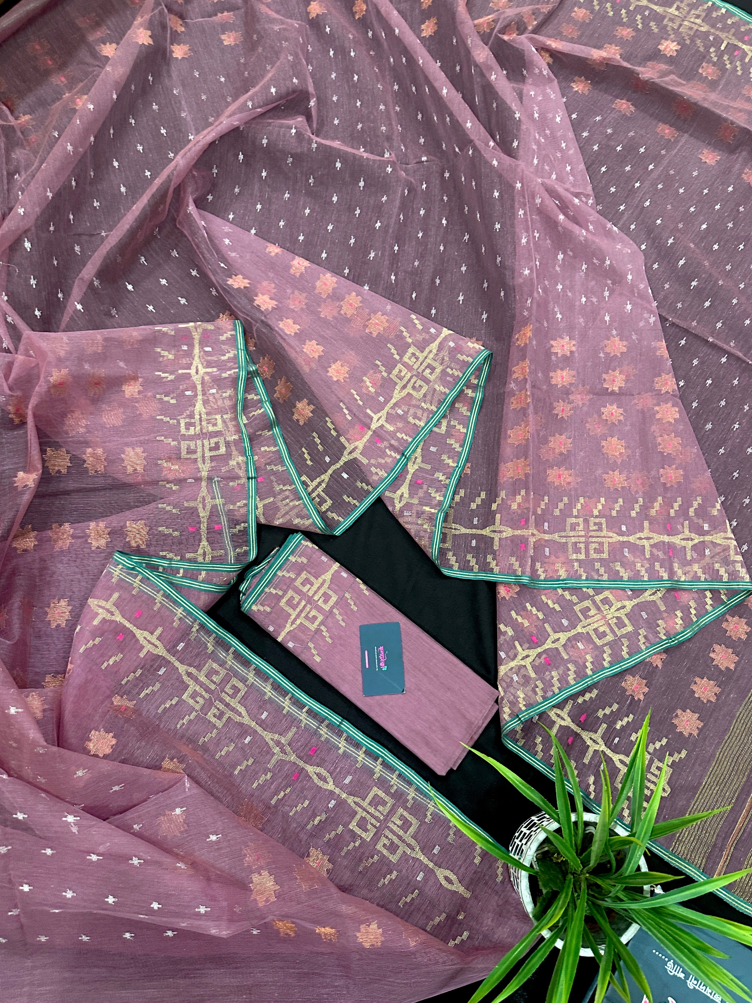 Onion colour jamdani saree with pink meena and green border.
