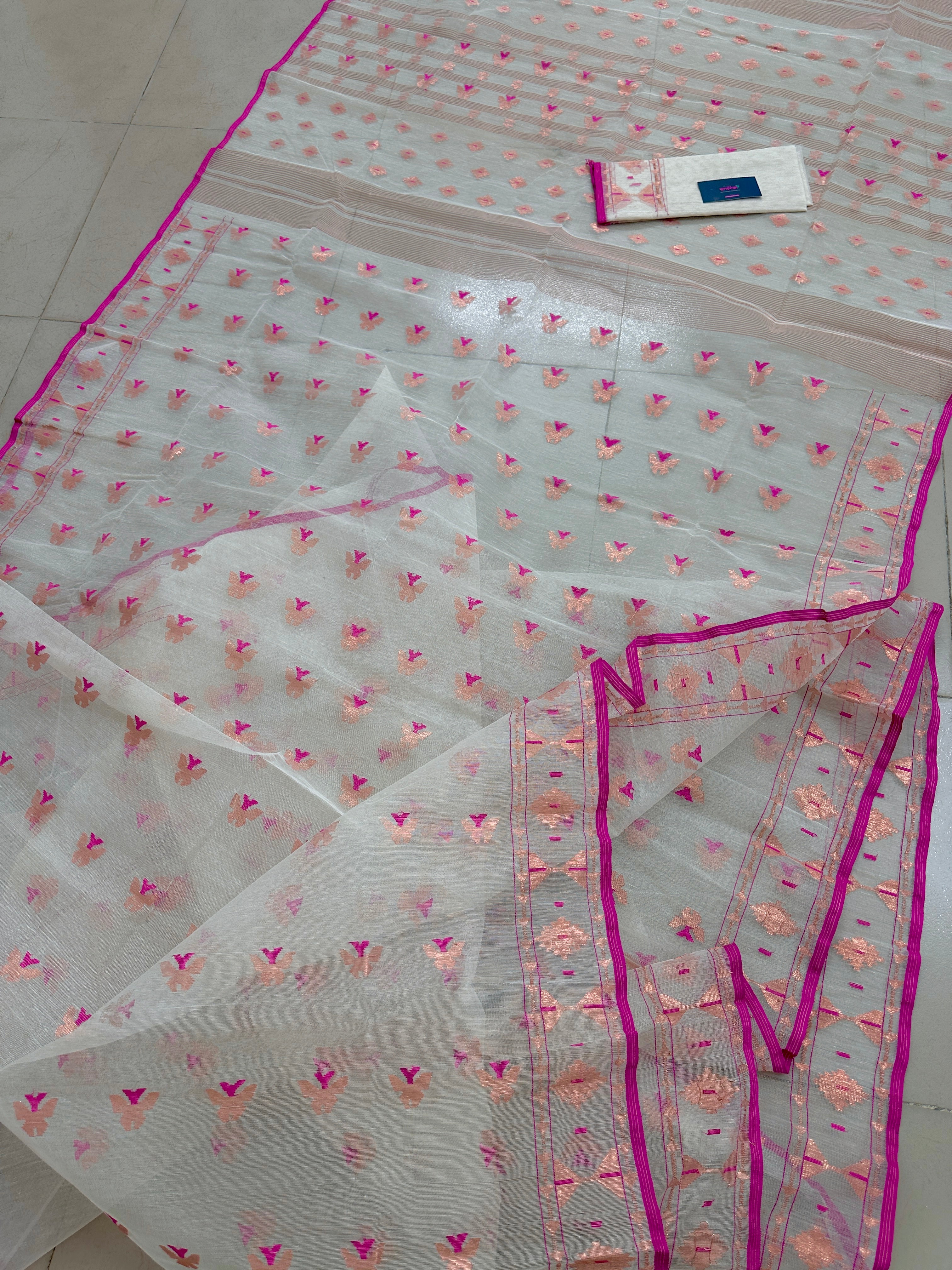 White Jamdani Saree Features Intricate Copper Jori Work.