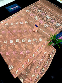 Creamy peach jamdani saree with pink white and peach threads work.