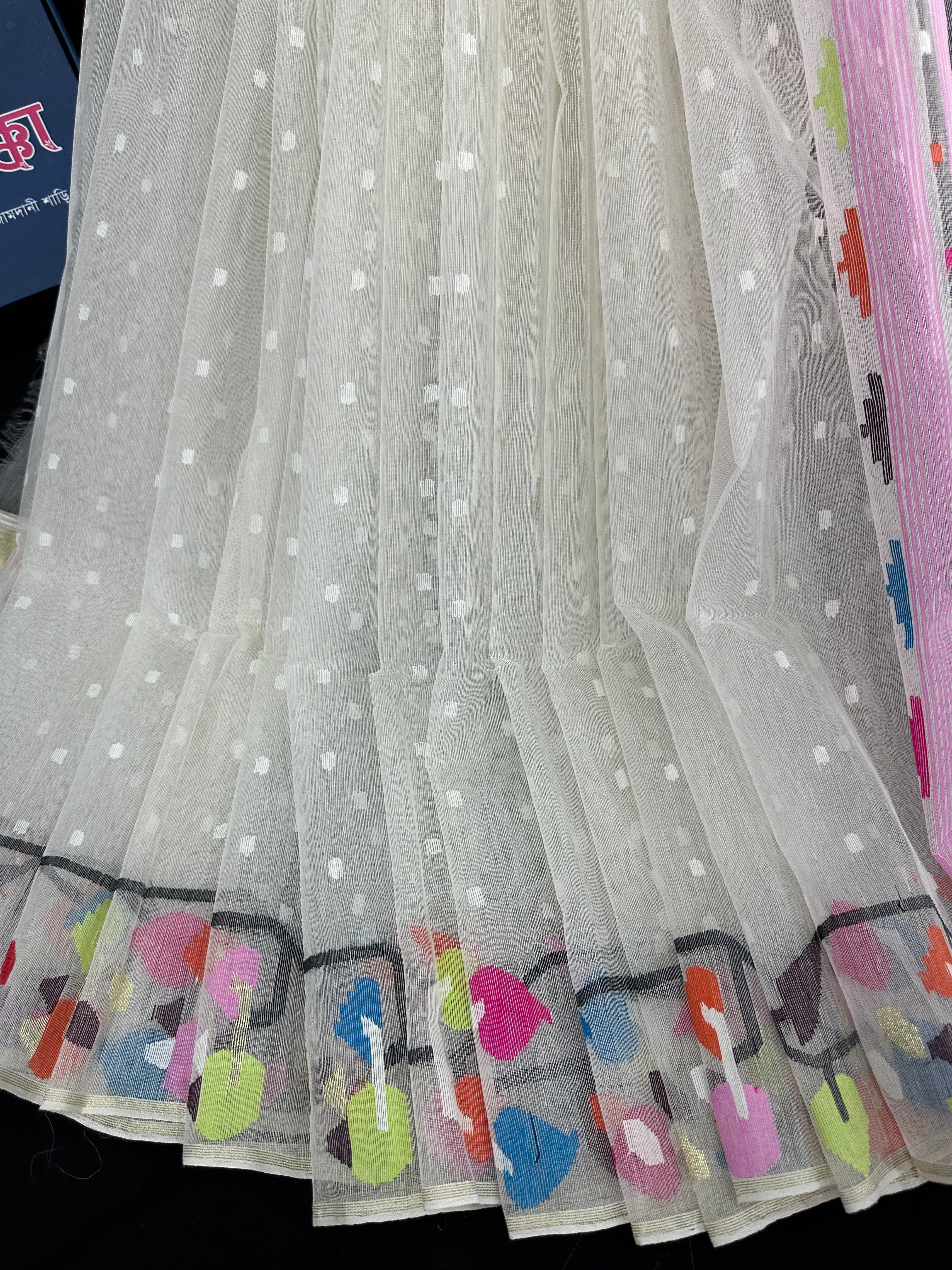 White cotton jamdani saree with pink blue orange magenta yellow multiple colour threads work