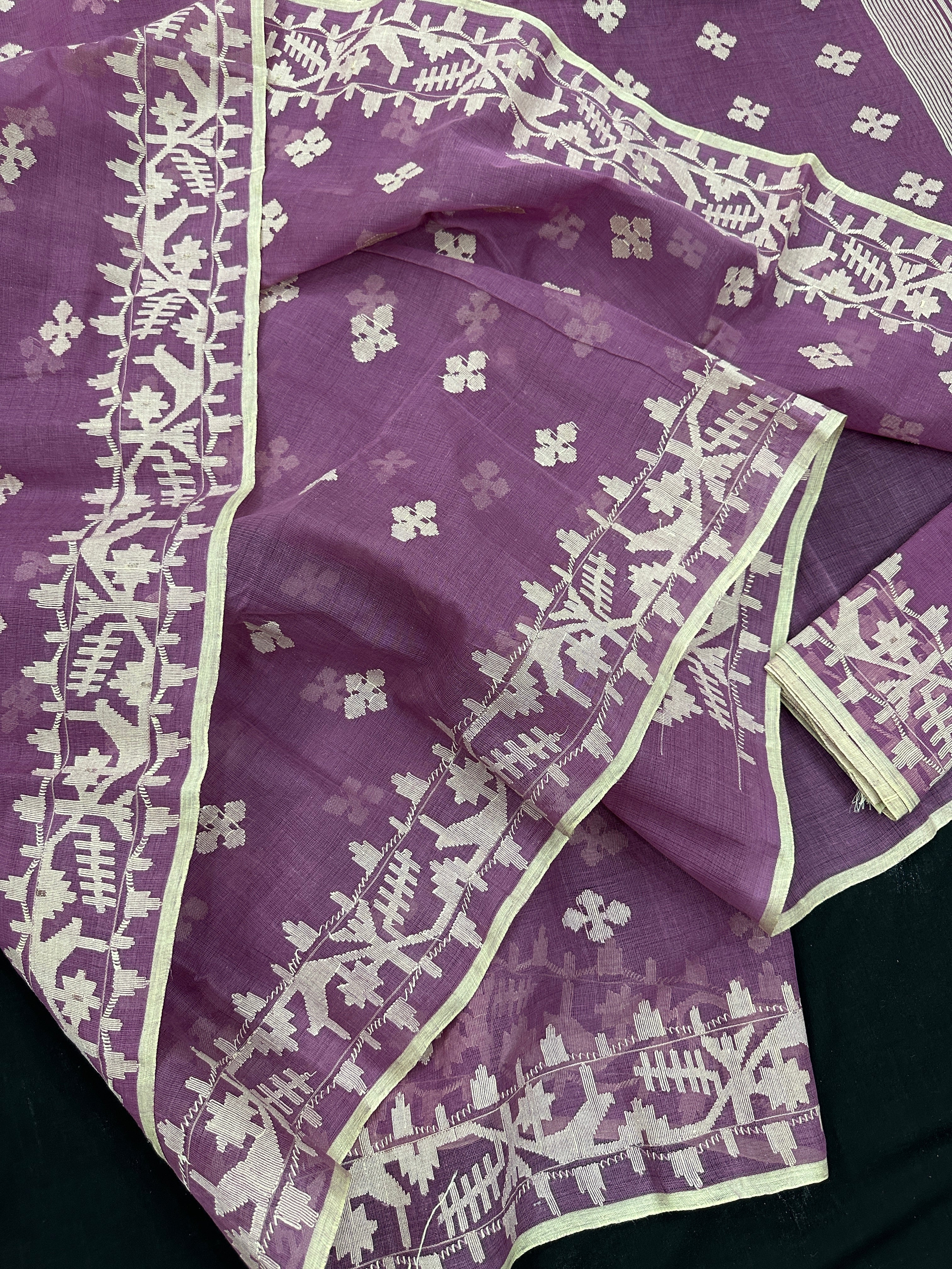 Onion cotton jamdani saree with yellowish threads work all over work.