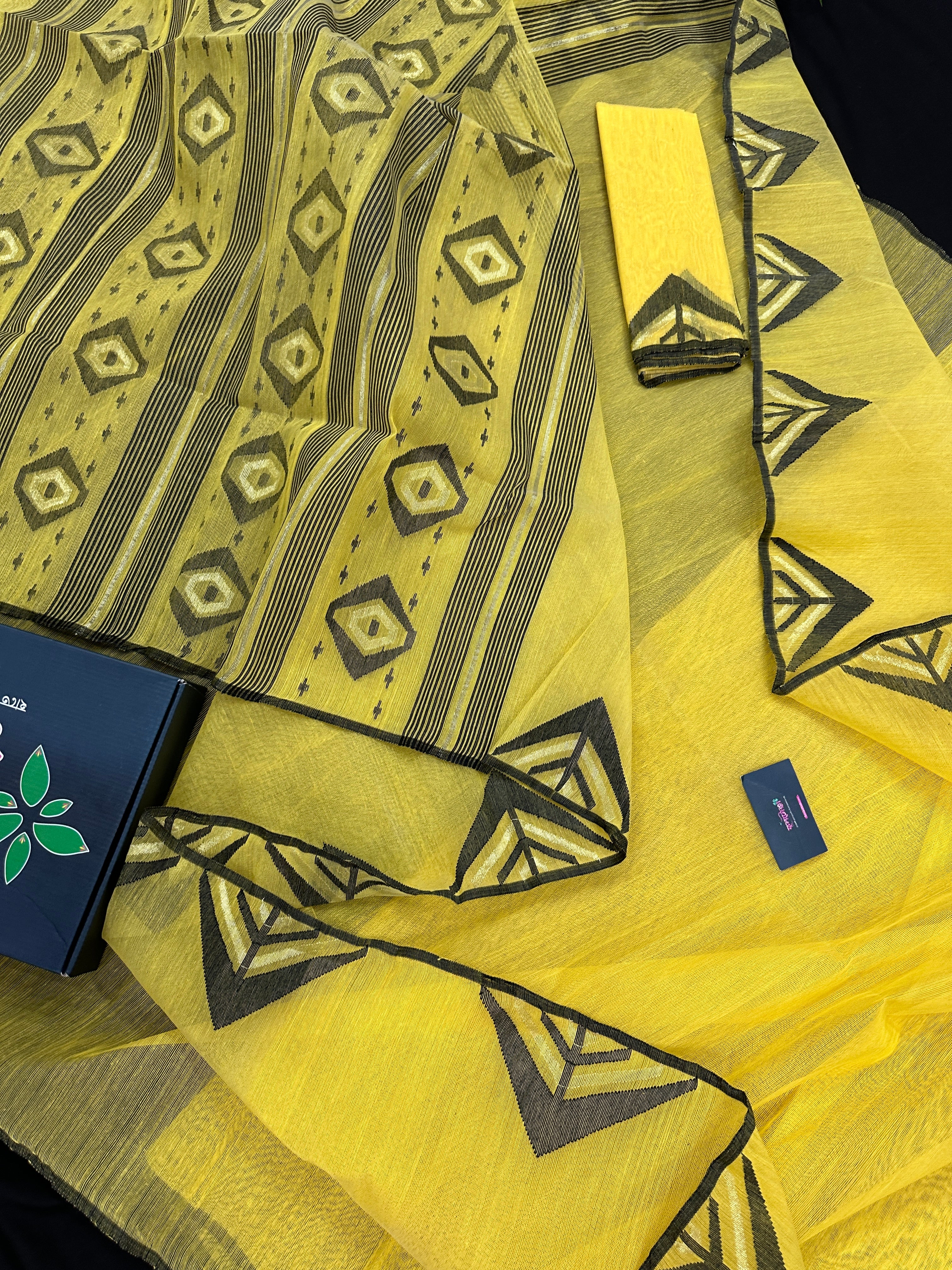 Yellow cotton jamdani sari with simple paar.