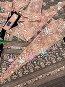 Creamy peach jamdani saree with pink white and peach threads work.
