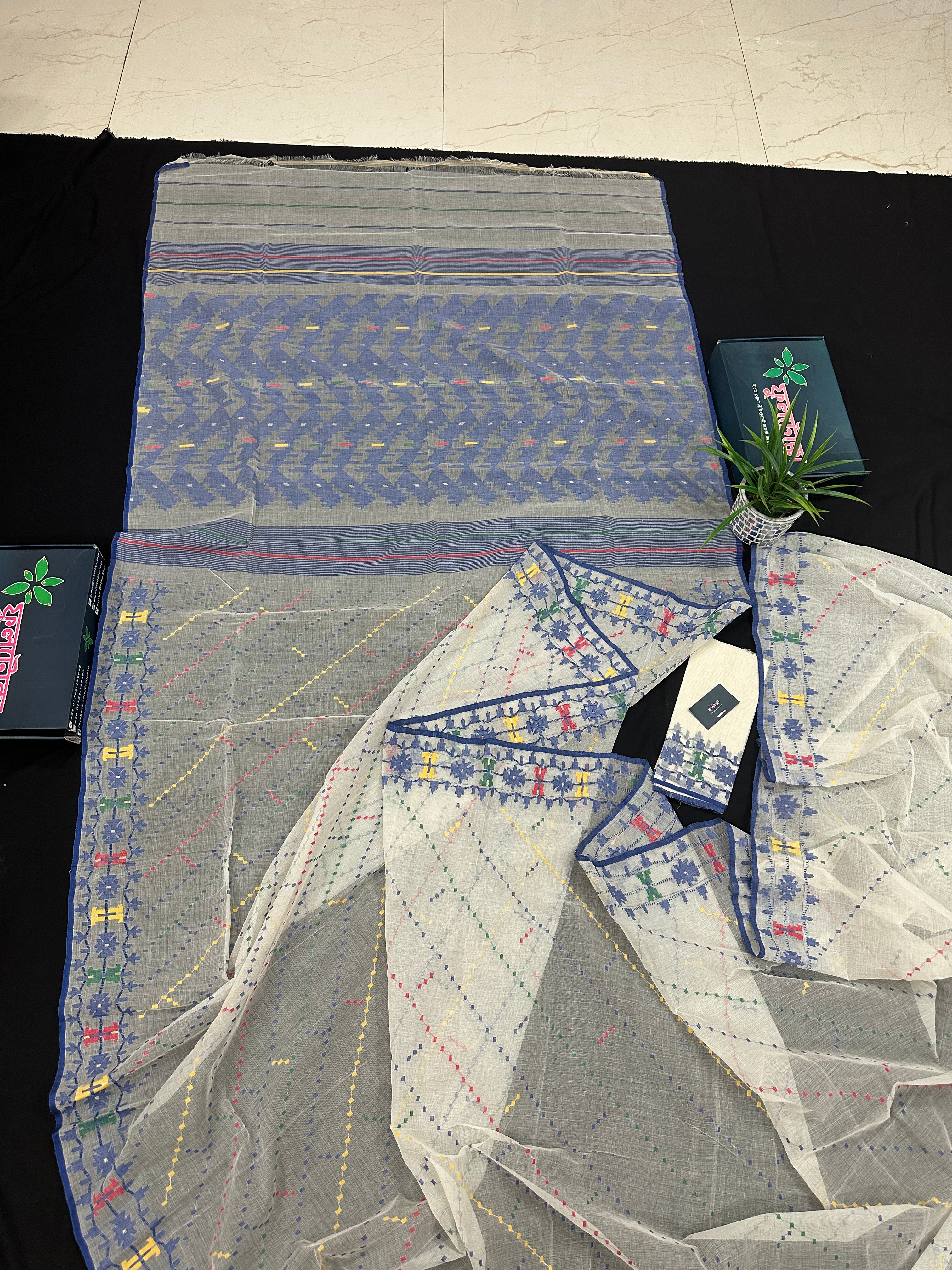 White cotton jamdani saree with blue yellow red green threads work& blouse piece.