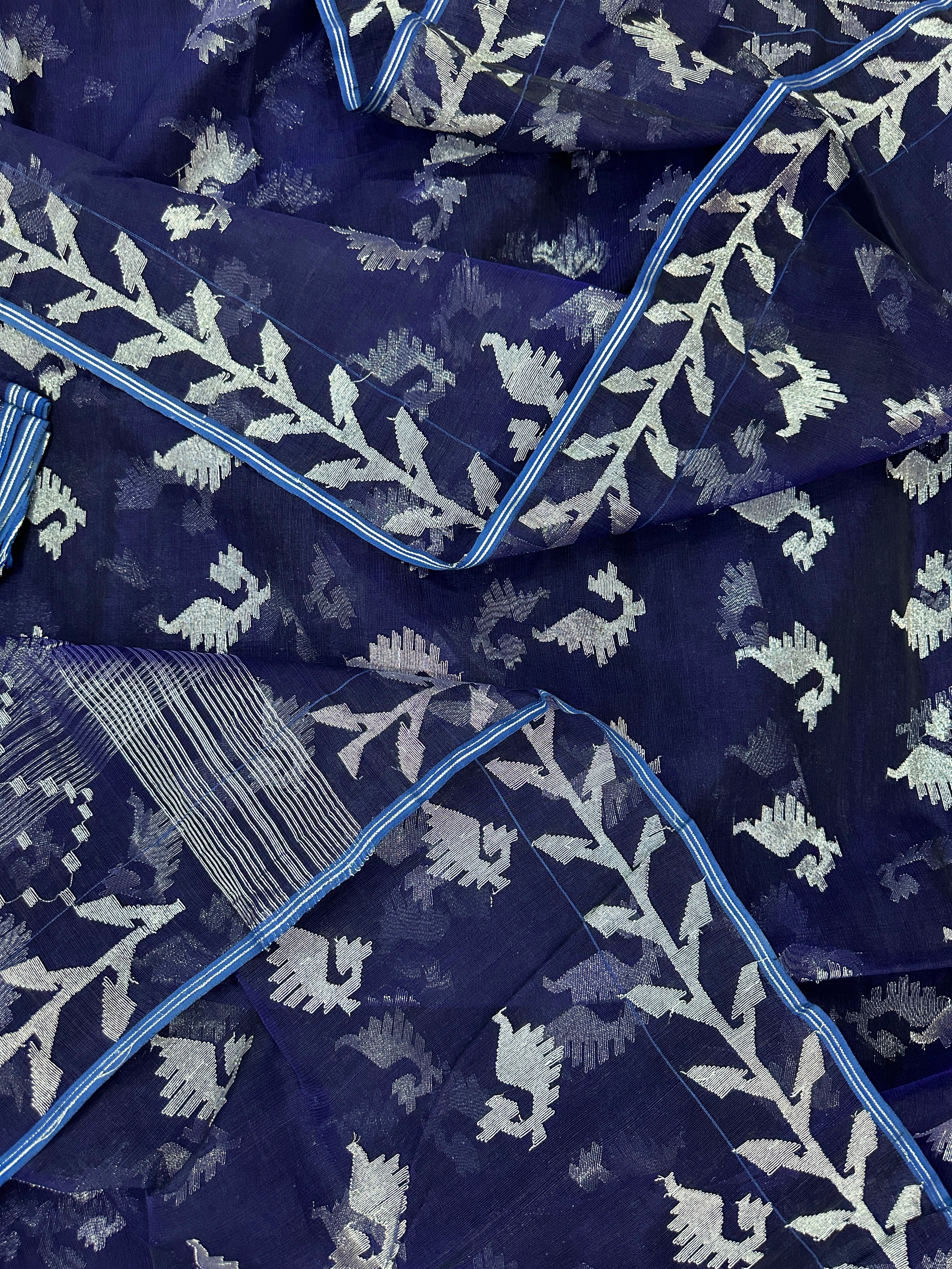Navy blue jamdani saree with silver jori work soft threads all over work.