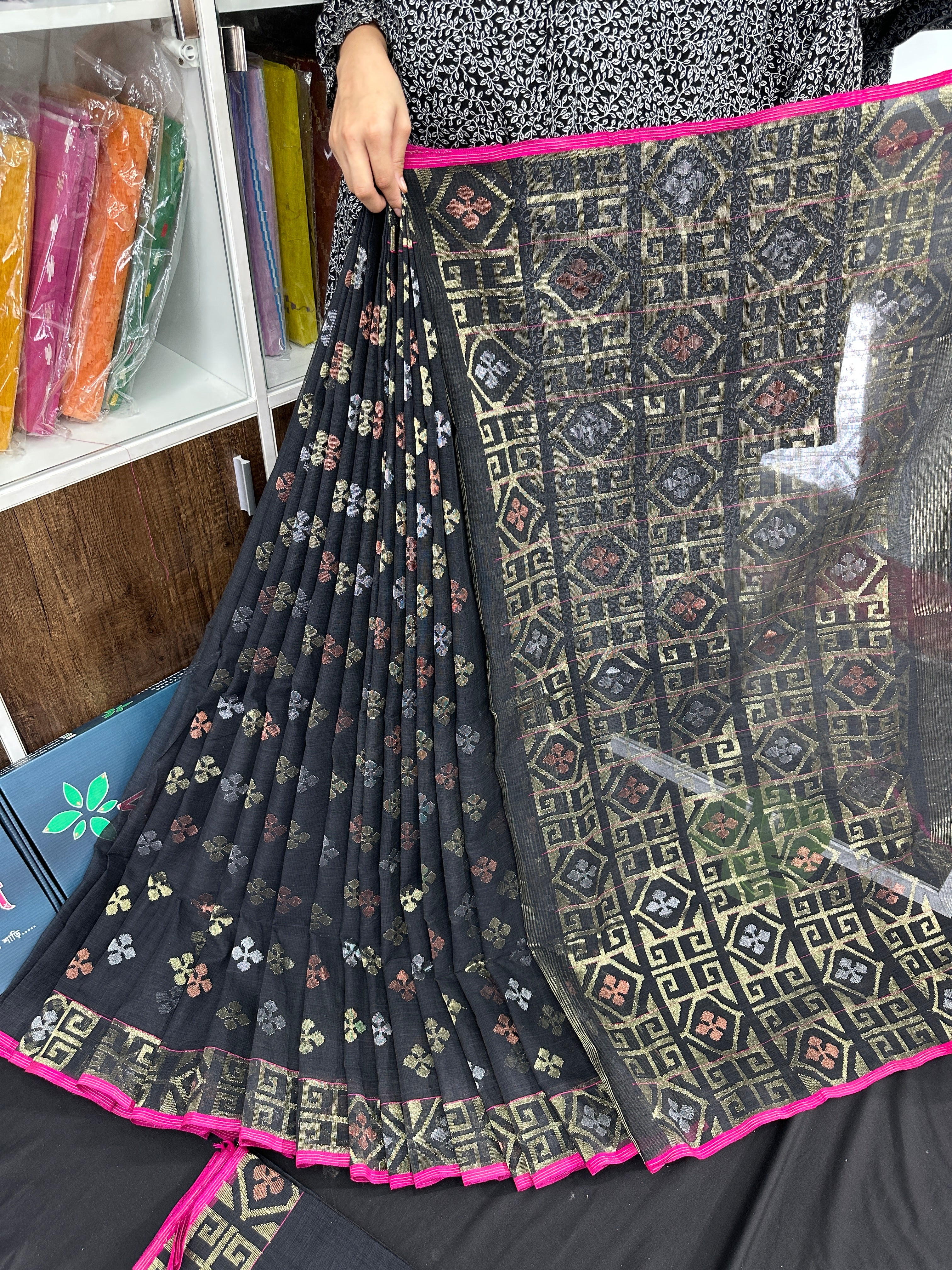 Black jamdani saree with golden silver and copper jori work and pink border