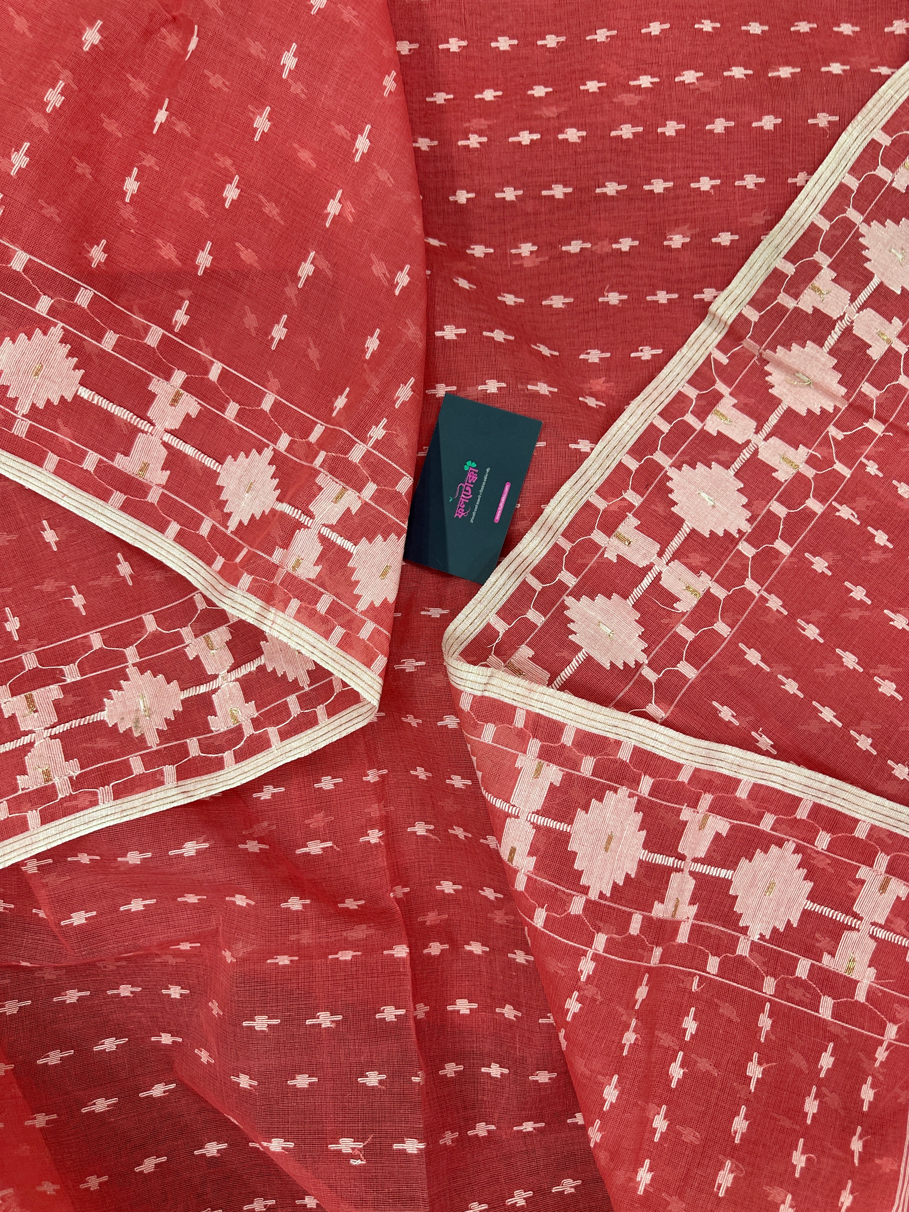Sweet pink cotton jamdani saree with white threads work and blouse piece.