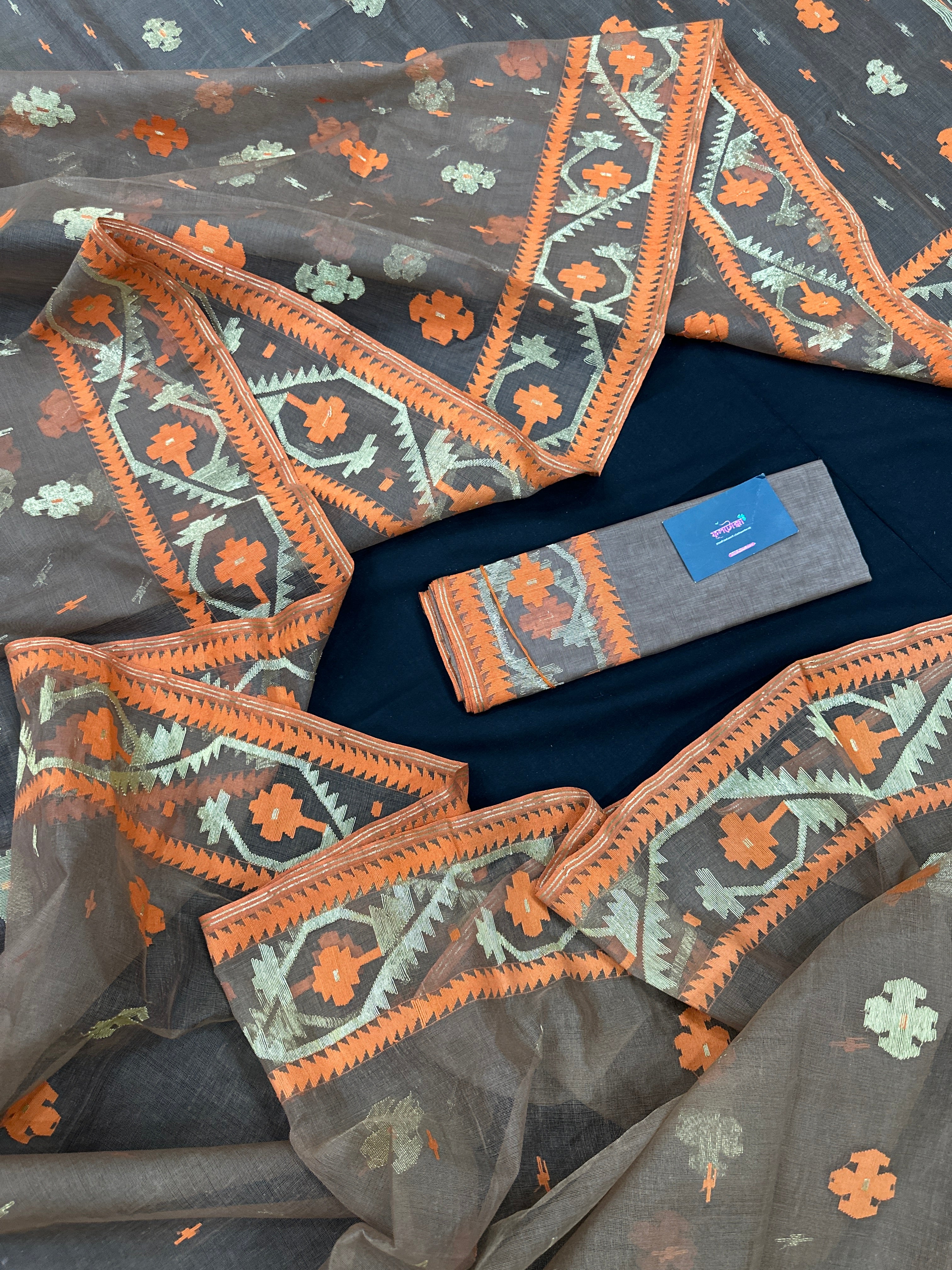 Peanut Brown dhakai jamdani saree with orange threads work & golden jori work all over soft count.