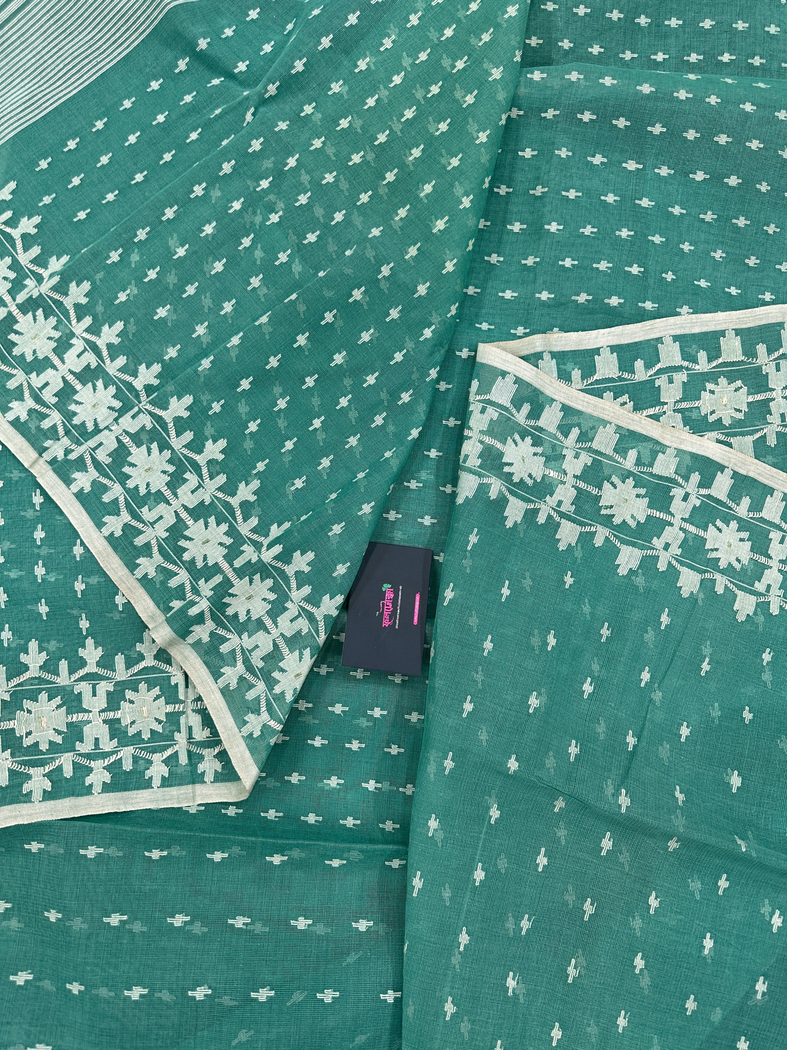 Mint cotton jamdani saree with white threads work all over work and blouse piece.