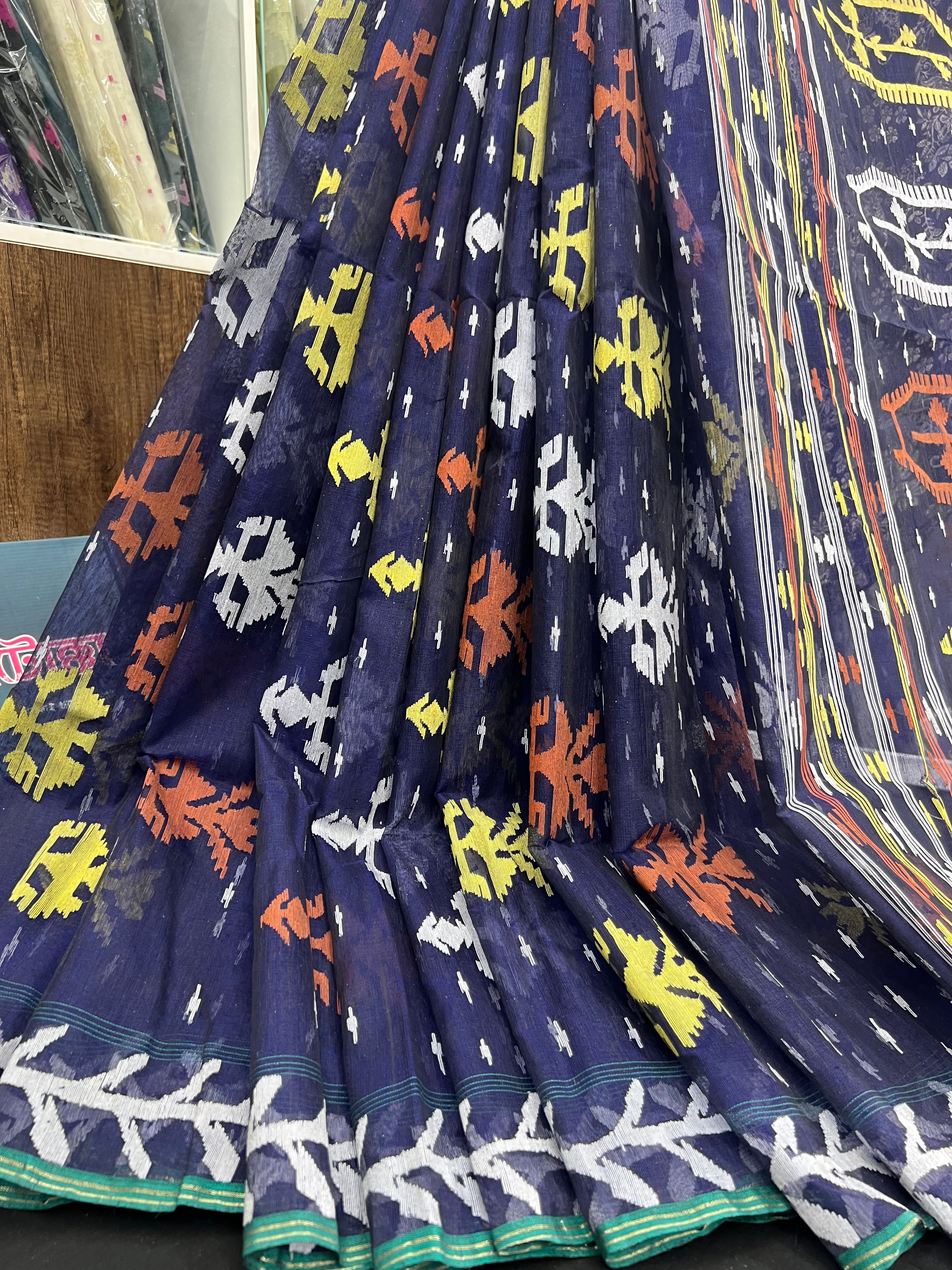 Deep blue halfsilk jamdani saree with orange yellow white threads work